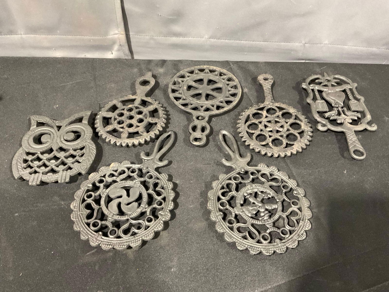 7 Cast Iron Trivets, Unique Designs, Owl shaped, and round scalloped edges, 5h x 11w x 8d inches (1 of 4)