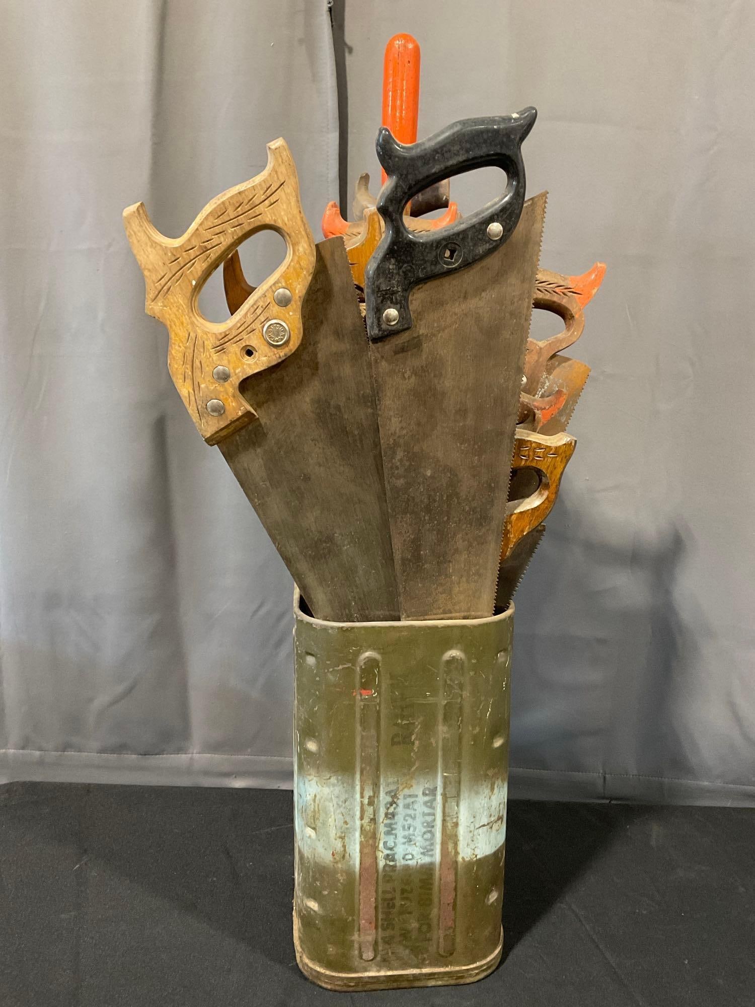 Large Assortment of Saws, Craftsman Crosscut & more, Green Metal Mortar Tin, & large Chisel & Bit: *No in-house shipping, due to size and weight* Appears to be in fair to good shape. Measures approx 36h x 13w x 12d inches. See pics. E-5360 *No in-house shipping, due to size and weight* 