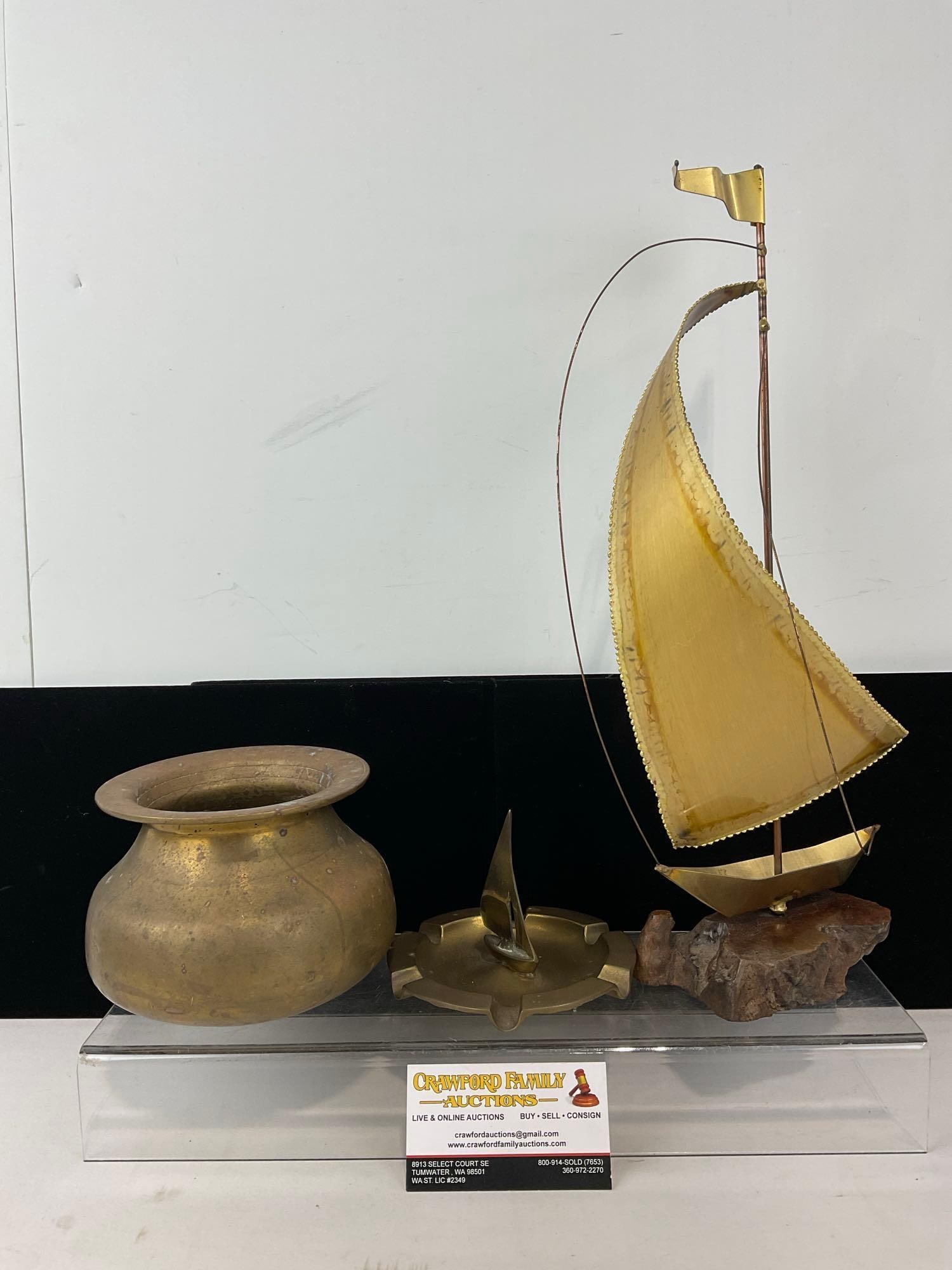 Brass Ship Figure on wood base, Ashtray w/ Ship figure, & Solid Brass Vase w/Rocks inside: Appears to be in good shape. The piece measures approx 17h x 10w x 10d inches. See pics. E-4880