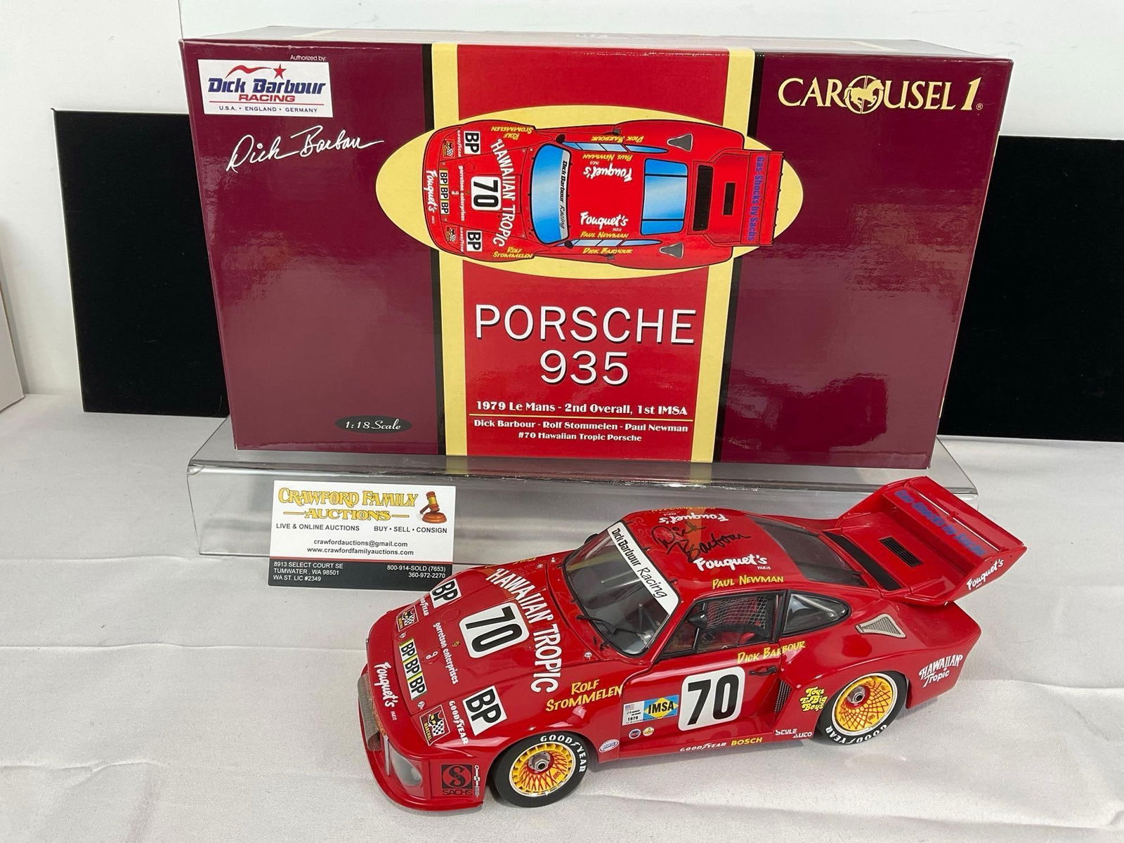 Carousel 1 Signed by Dick Barbour Porsche 935 1979 Le Mans 1/18 Scale Diecast Car Model orig box: #70 Hawaiian Tropic. Signed on the roof of the car. Appears to be in good shape. The piece measures approx 6h x 15w x 9d inches. See pics. E-5420 