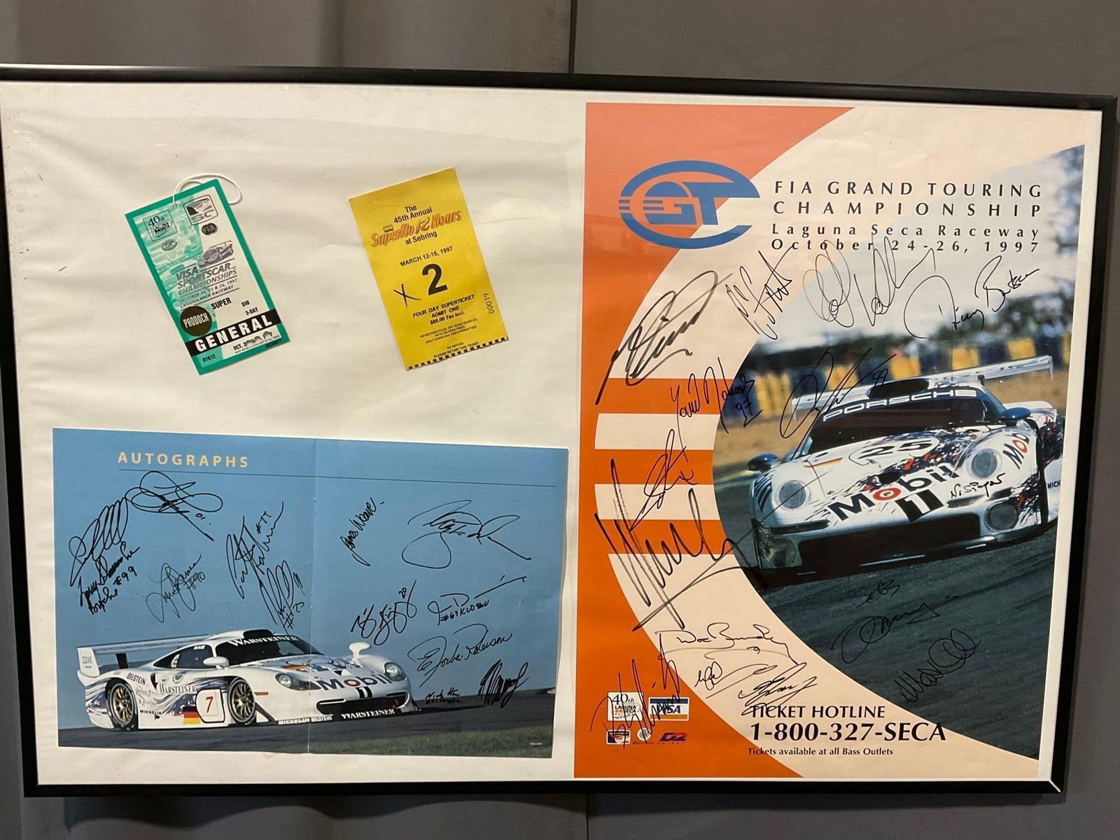 Framed FIA Grand Touring Championship Laguna Seca Raceway Poster, Signed by many drivers, & tickets: Signed by many drivers, including, as mentioned by the consignor: Butch Leitzinger, James Weaver, Nick Harn, Franz Konrad, Jim Downing, Pete Halsmer, John Paul Jr, Elloit Forbes Robinson, Andy