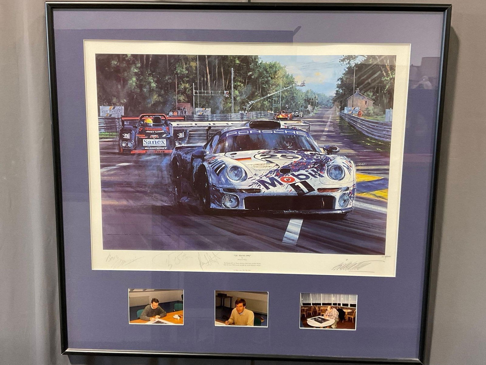 Framed Litho titled Le Mans 1996 by Nicholas Watts #d 343/600, 33h x 35w x 3d in, signed by drivers: w/COA, Signed by Thierry Boutsen, Hans Stuck & Bob Wollek & Nicholas Watts. Appears to be in good shape. The piece measures approx 33h x 35w x 3d inches. See pics. E-5420 *Oversized