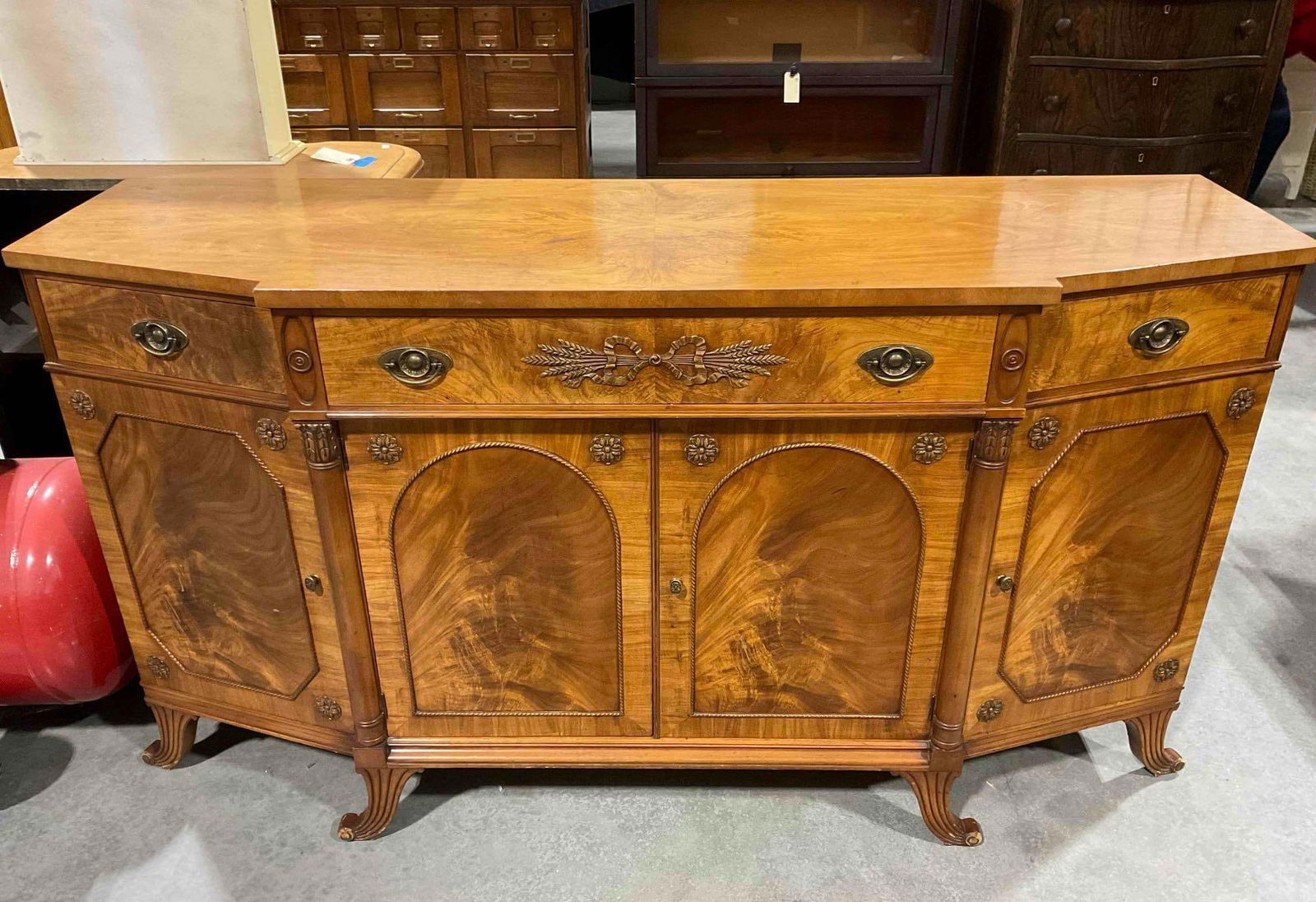 Gorgeous Vintage Batesville Cabinet Co. Brazilian Walnut Sideboard Buffet. Excellent Cond.: Gorgeous Vintage Batesville Cabinet Co. Brazillian Walnut Sideboard Buffet. Excellent Condition. Part of set with lot 78 & 123. Measures 66" x 21" x 36" DM-5550. *Freight Required if shipped,