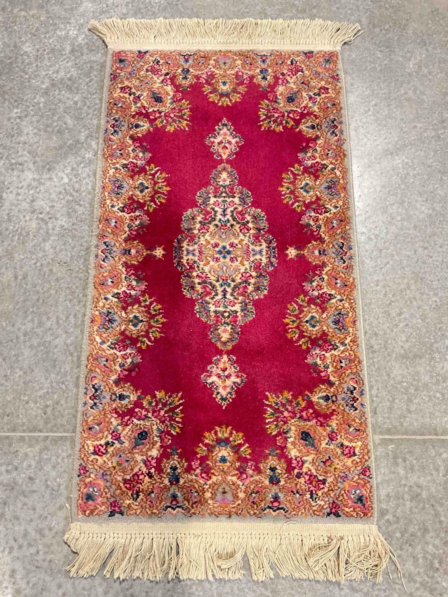 Vintage KARASTAN Red Medallion Kirman Pattern Wool Pile Rug. Very Good Condition. See pics.: Vintage KARASTAN Red Medallion Kirman Pattern Wool Pile Rug. Very Good Condition. Measures 56" x 26" Minor wear indicative of age, otherwise in very good condition. DM-5520 