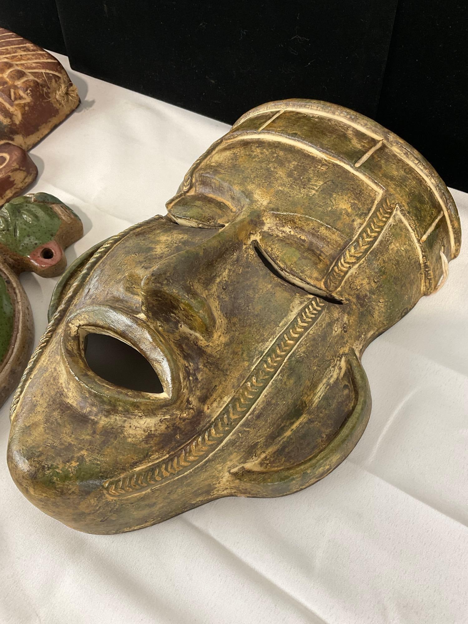 Three Pottery Masks, Mayan style, Red, Green & Yellow Glazed, 14h x 16w x 11d inches - 2