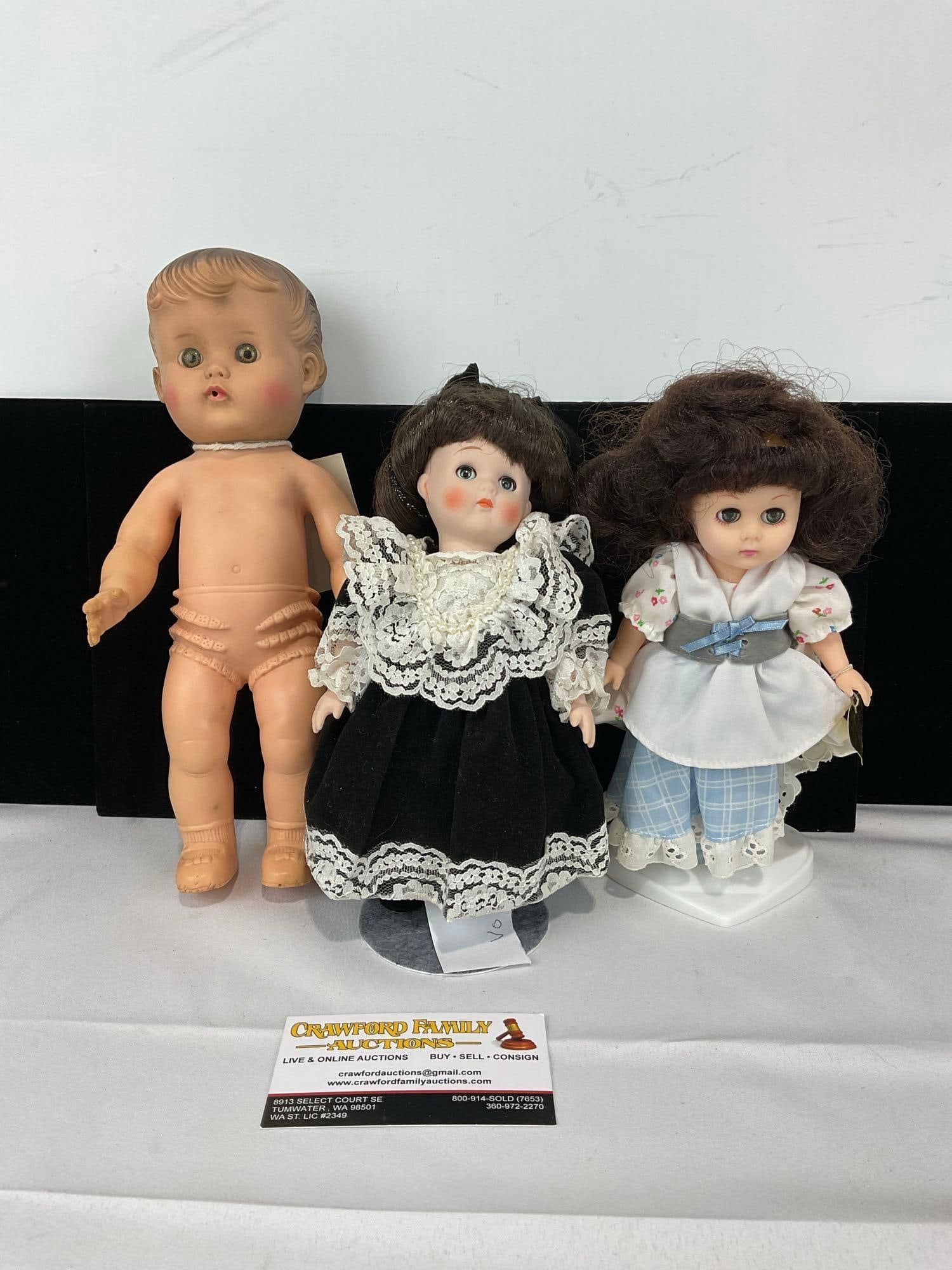 1956 10 inch Doll by Sun Rubber Co, Vogue 1984 w/tag & Vogue Ginny, w/ 2 stands: Appears to be in good shape. The piece measures approx 9h x 11w x 6d inches. See pics. E-5430 