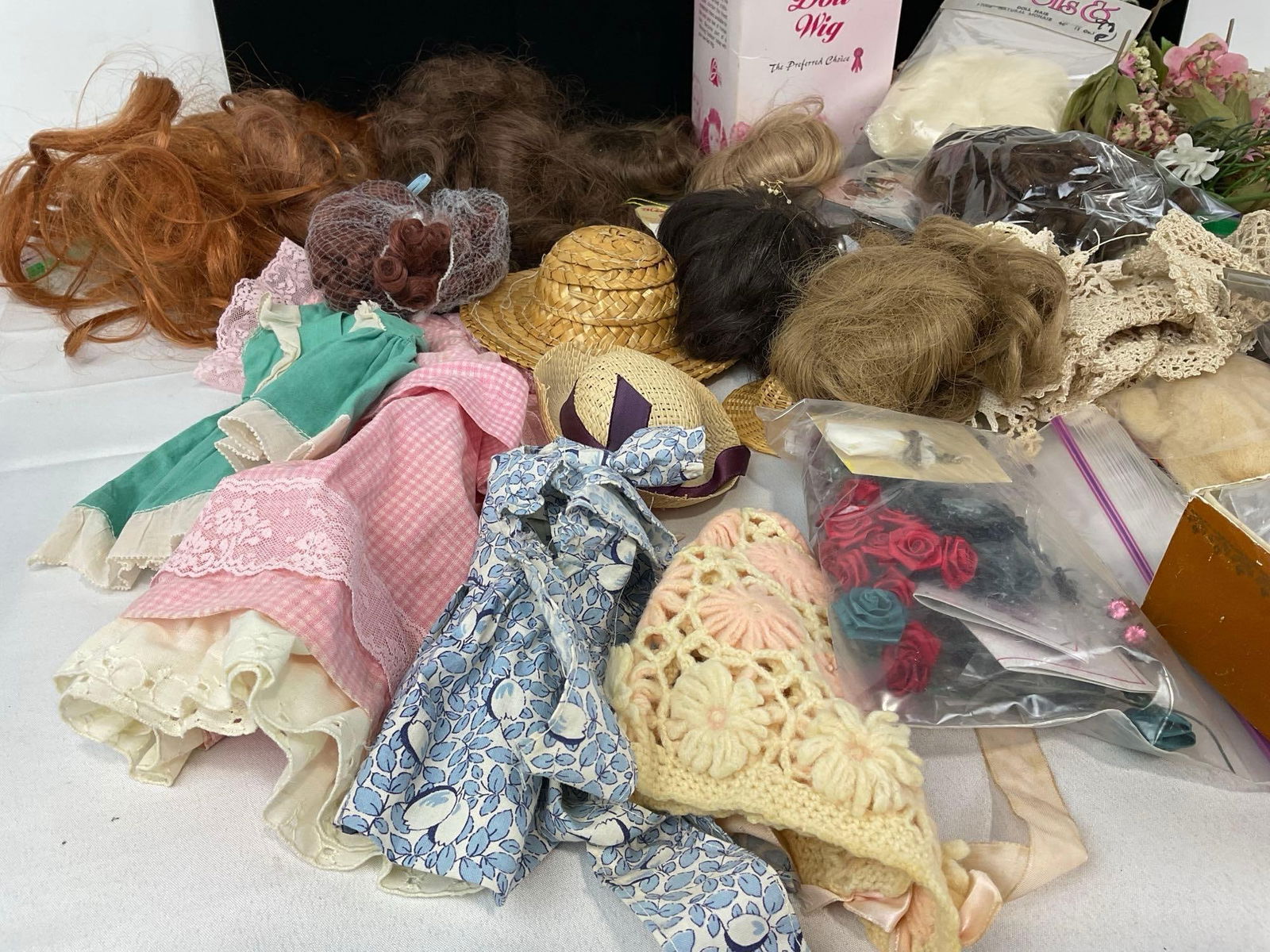 Assorted Straw Hats, Doll Hair/Wigs, some in box & packaging, & Dresses & accessories - 2