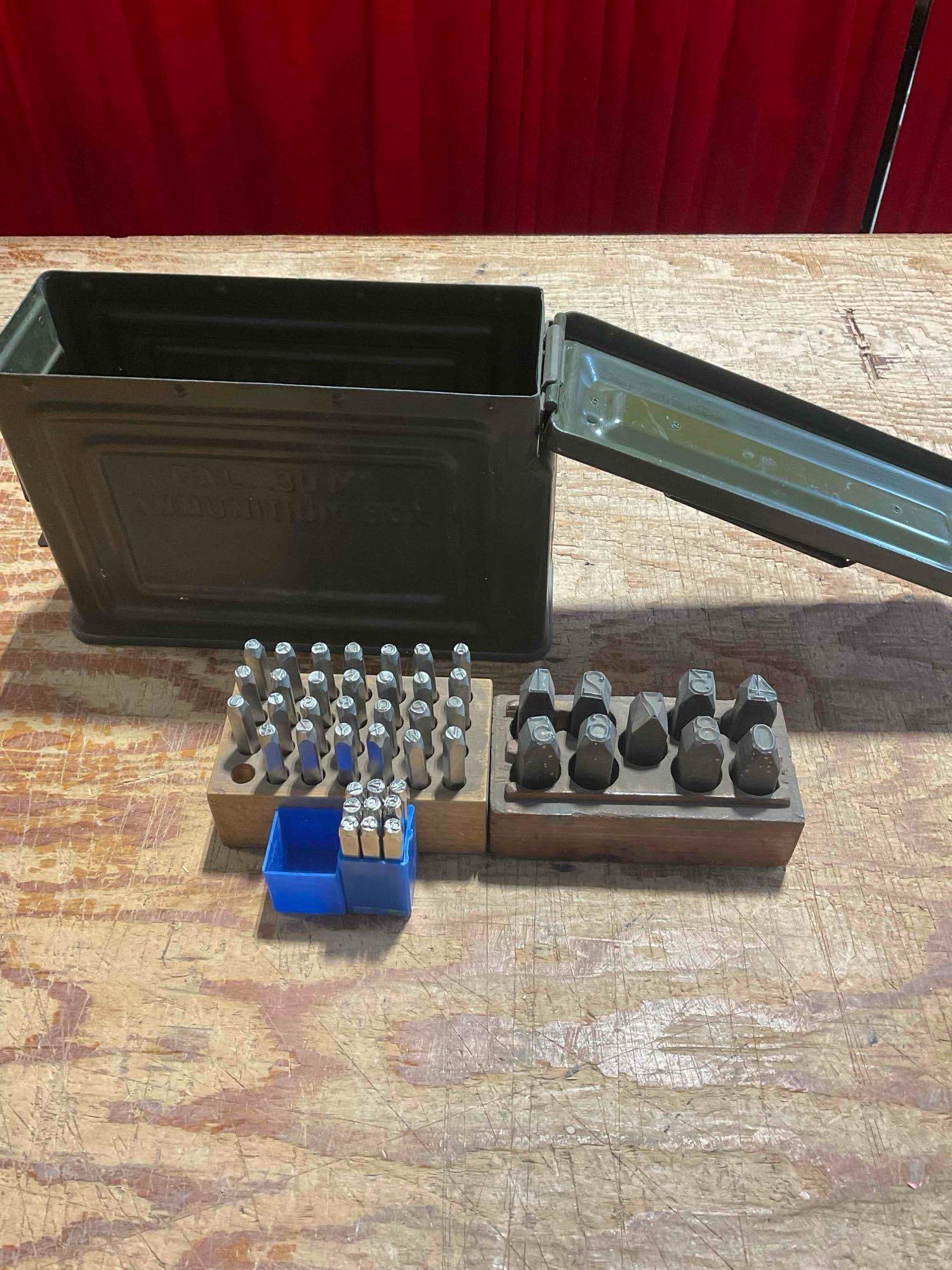 Collection of Metal Letter and Numerical Punches with an Army Ammo Can Carrying Case: Approximately 12" x 5" x 9" items are in fair condition with all letters and numbers accounted for. Number punches run 0-9 and whole alphabet is present. V-5360 