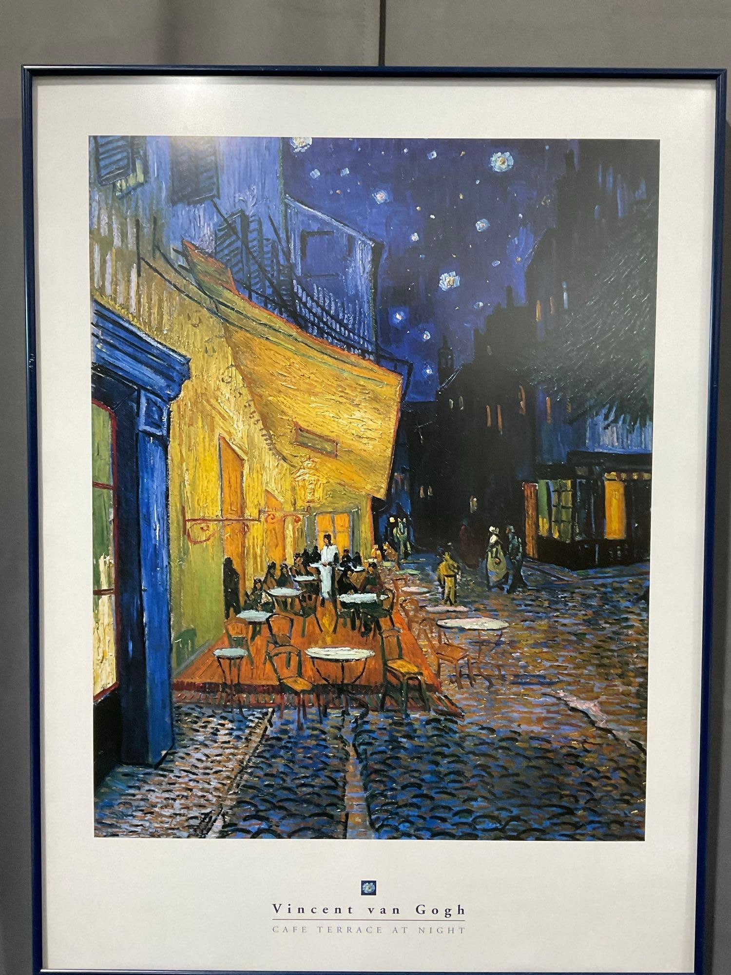 Framed Art Print titled Cafe Terrace At Night by Vincent van Gogh, 33h x 25w x 3d inches: Appears to be in fair to good shape. The piece measures approx 33h x 25w x 3d inches. See pics. E-5550 