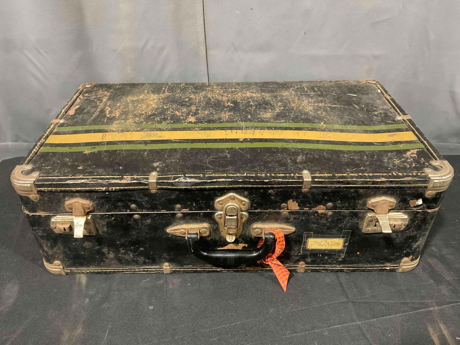 Vintage Black Metal Suitcase w/ Orange & Green Stripes. Good Condition. See pics.: Vintage Black Metal Suitcase w/ Orange & Green Stripes. Good Condition. Has wear indicative of age, condition is otherwise good. Measures 24" x 8" x 17" DM-5440 *Oversized shipping may apply*