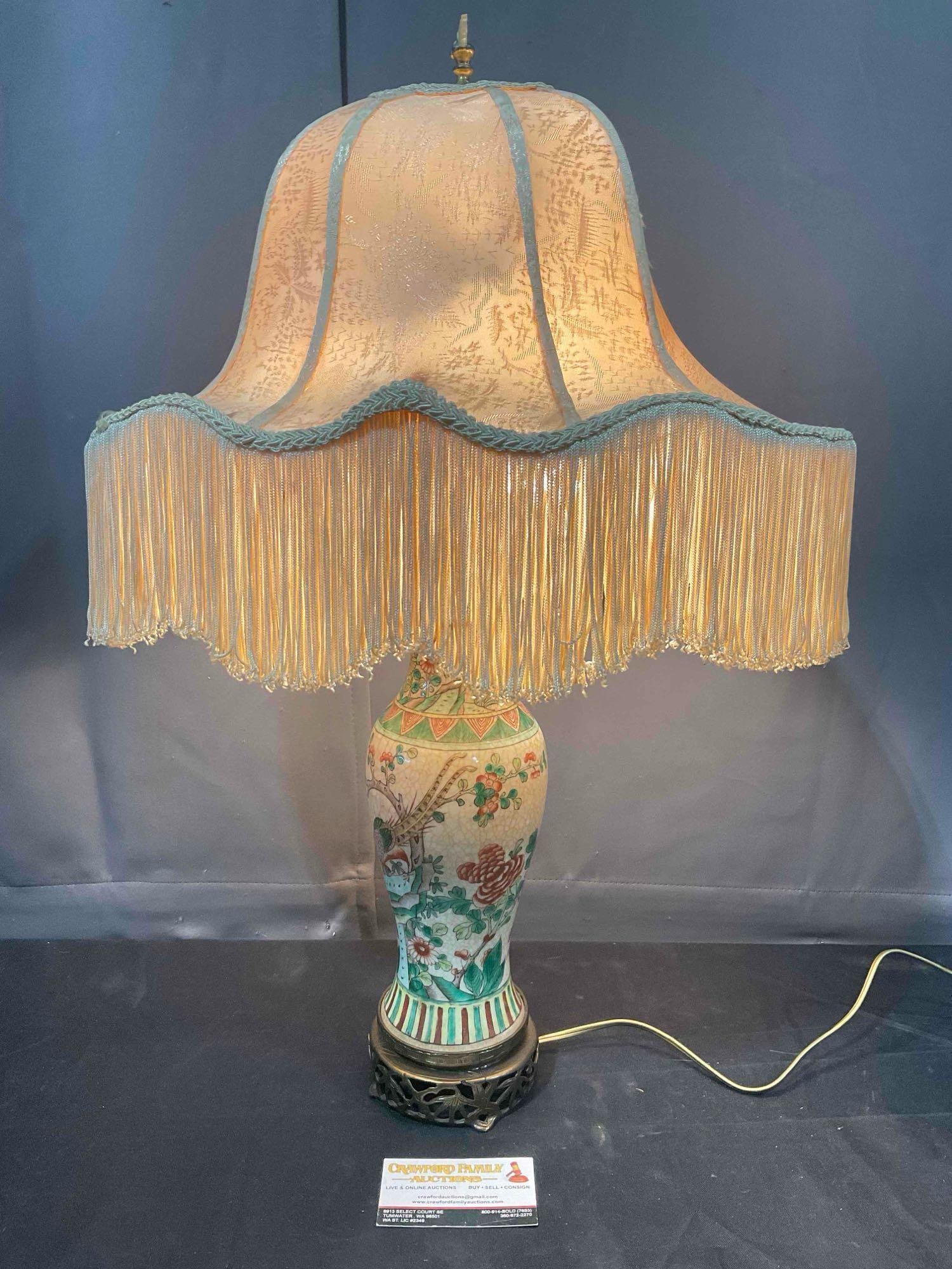 Vintage Chinese Table Lamp w/ Famille Rose Urn Base & Cream Cloth Shade. Tested, Works.: Vintage Chinese Table Lamp w/ Famille Rose Urn Base & Cream Cloth Shade. Tested, Works. Minor wear to shade, finial is missing a piece, condition is otherwise very good. Measures 16" x 12" x 26"