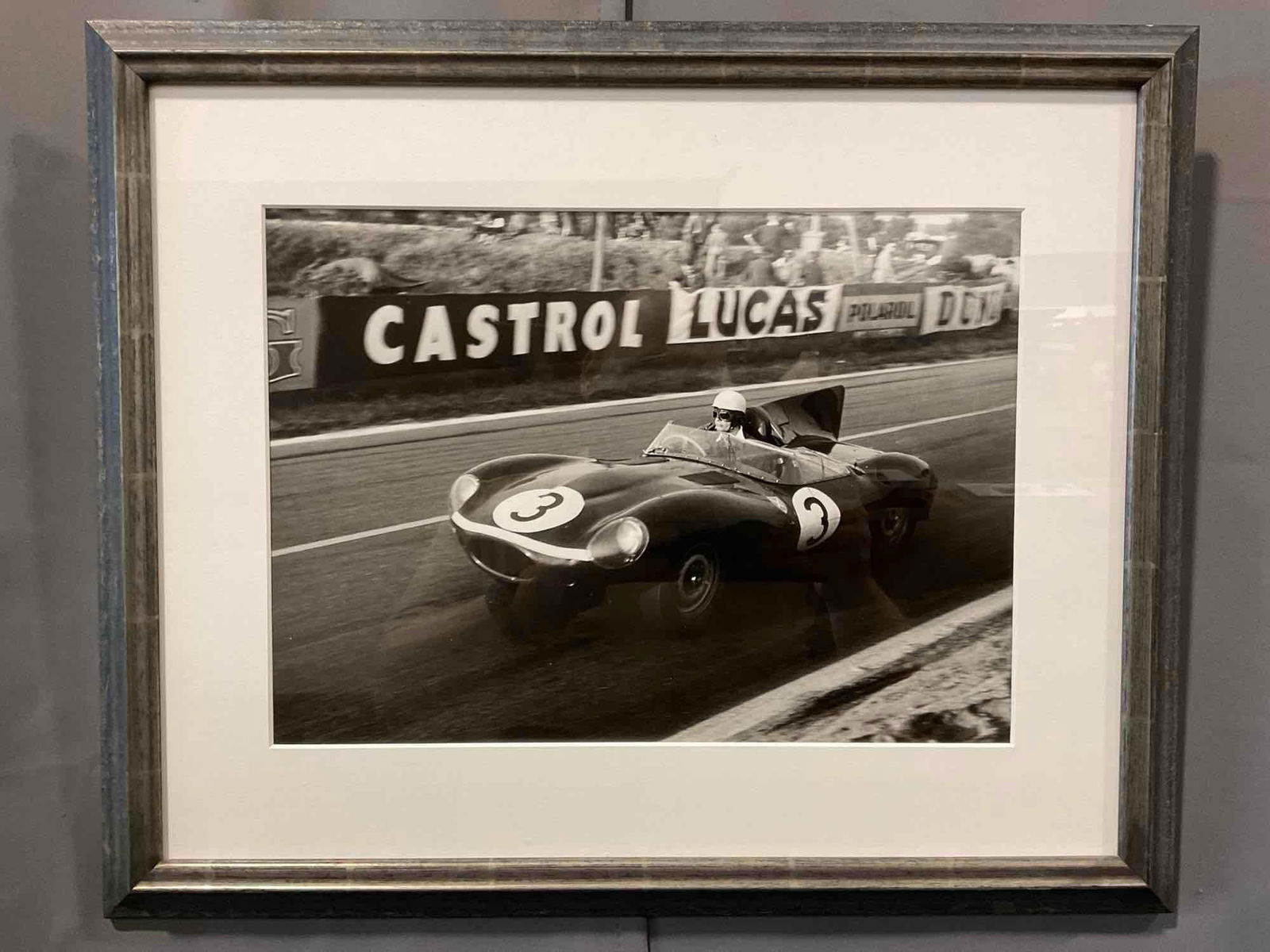 Framed Racing Photo, Ron Flockhart Le Mans 1957 D-Type Jaguar GS19, 19h x 23w inches: Appears to be in good shape. The piece measures approx 19h x 23w x 3d inches. See pics. E-5420 