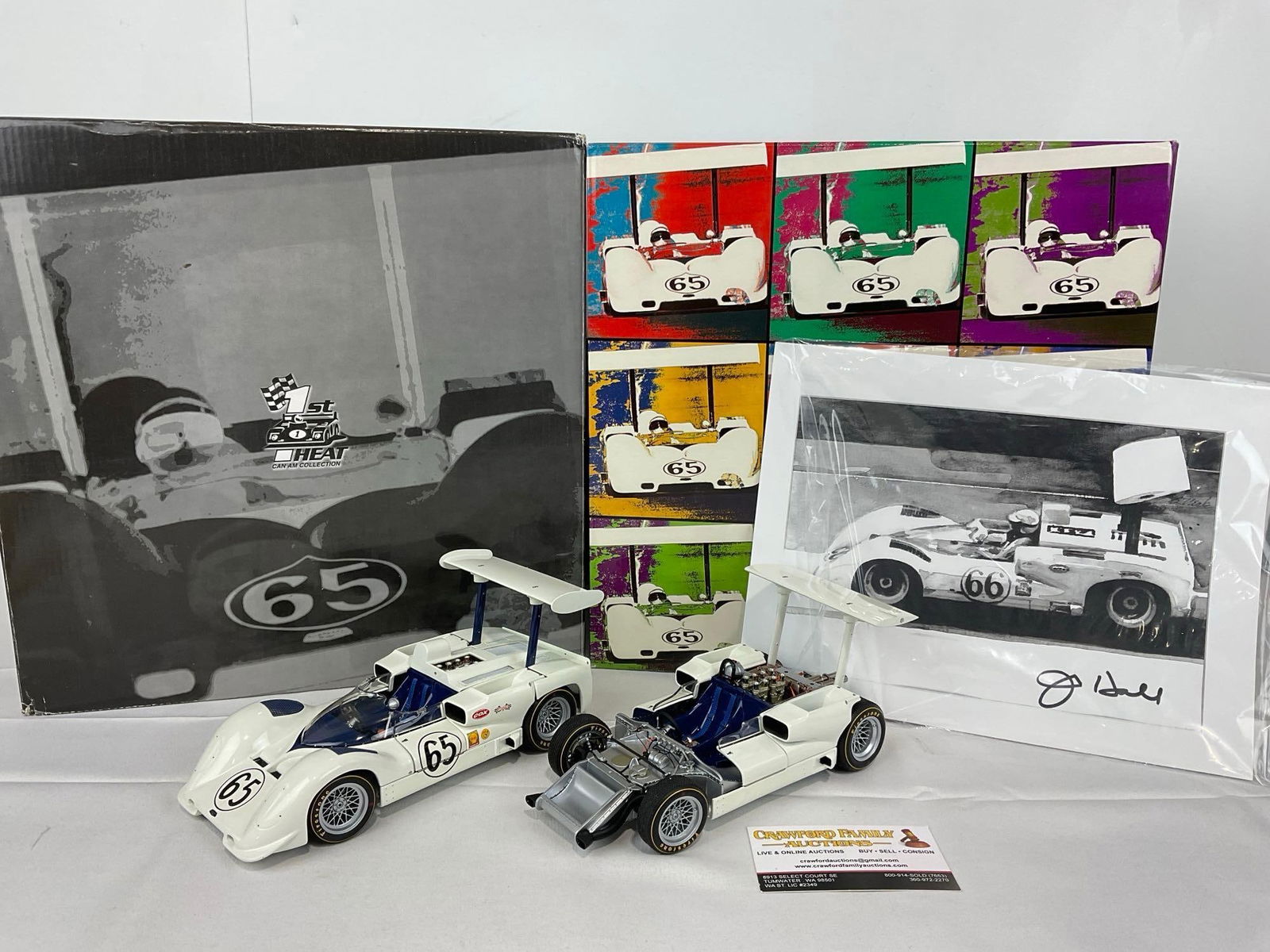 Set of 2 1966 Chaparral 2E Laguna Seca, 1/18 Scale Diecast Car Models w/signed Photo: The photo included looks to be signed by one of the drivers. Appears to be in good shape. The piece measures approx 7h x 14w x 14d inches. See pics. E-5420 