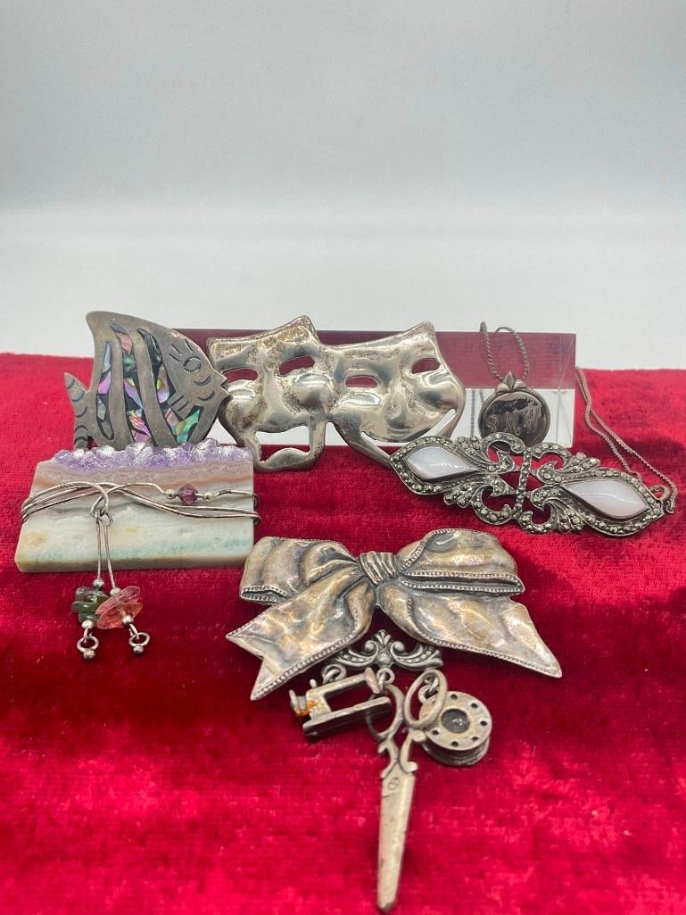 Collection of 5 Antique & Vintage Sterling silver brooches & necklace w/ inscribed pendant: c-414 Includes 1 modern Brooch with sterling wire wrap around a cut piece of amethyst & modern MOP inlaid Angel fish brooch. TW with out amethyst piece is 56.91 Gram, with amethyst 71.45 Gram