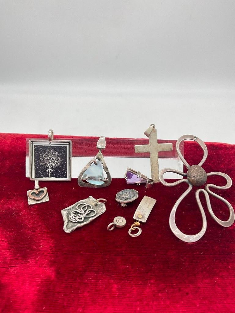 10 Assorted Sterling silver Pendants with stones Including large 1970's groovy Flower pendant: c-414 The flower holed pendant has what might be a brass center and is signed Voltatre or Voliaire TW in grams for everything is 40.63 