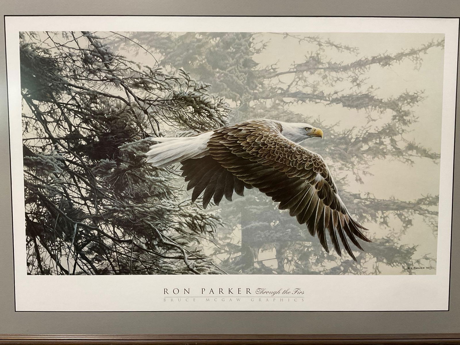 Framed Print titled Through the Firs by Ron Parker 1991, 31h x 43w x 3d inches: Appears to be in good shape. The piece measures approx 31h x 43w x 3d inches. See pics. E-5550 *Freight Required if shipped, Buyer Arranged/Responsibility* 