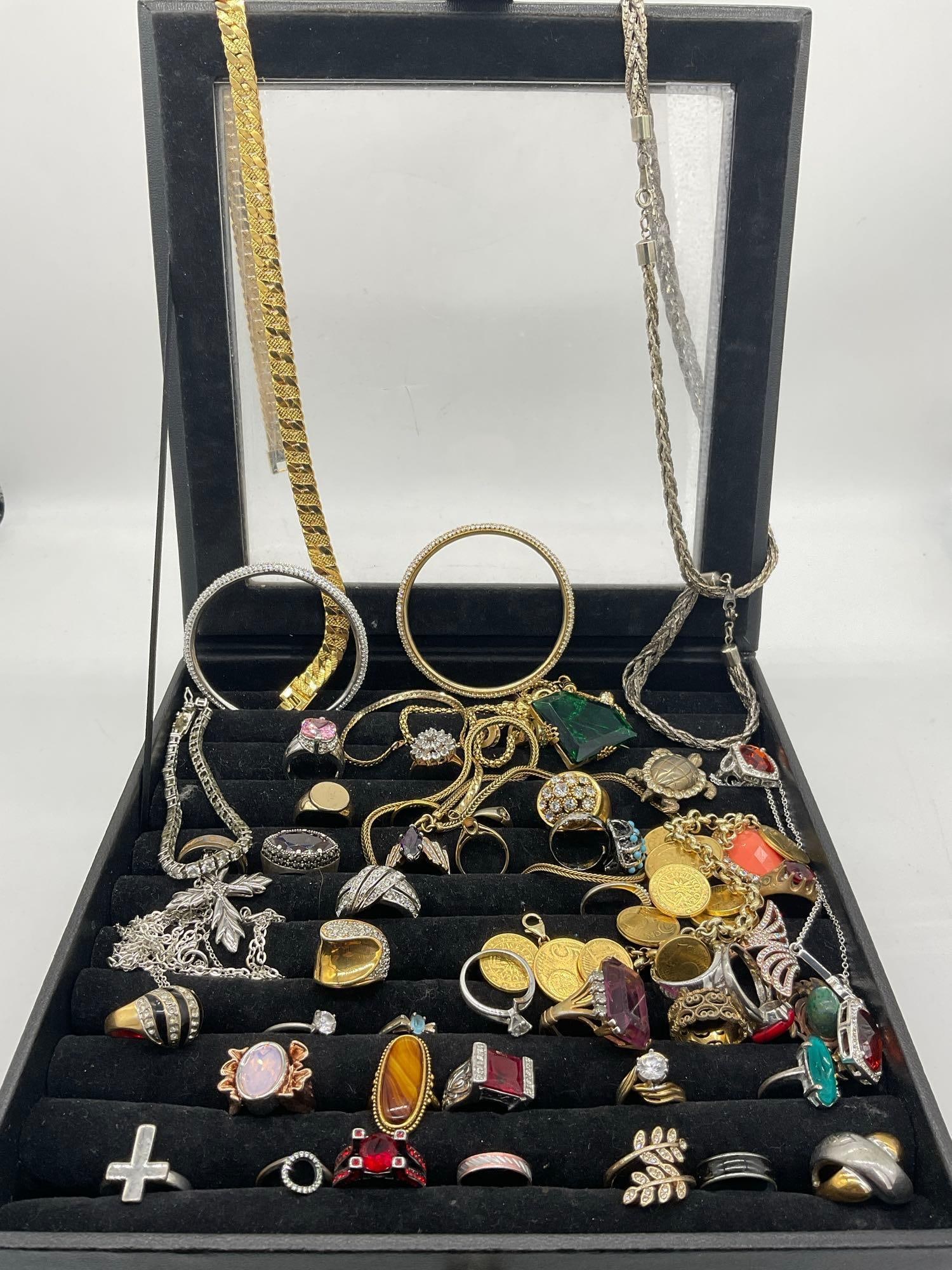 Approx. 40 Fashion rings w/ assorted sizes, stones + Gold & silver toned Necklaces, bracelets Plus: c-414 Nice set of assorted jewelry including approx 4 to 5 18K Heavy Gold Electroplated rings, Euro coin bracelet & some brooches / pins in a display ring box. 9" x 9" x 2" 