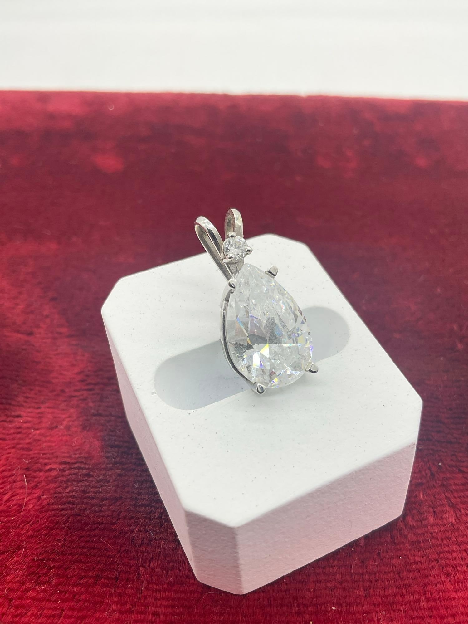 Large Approx. 1" / 14K white Gold pendant featuring a tear drop CZ / 3.52 grams Total weight - 2