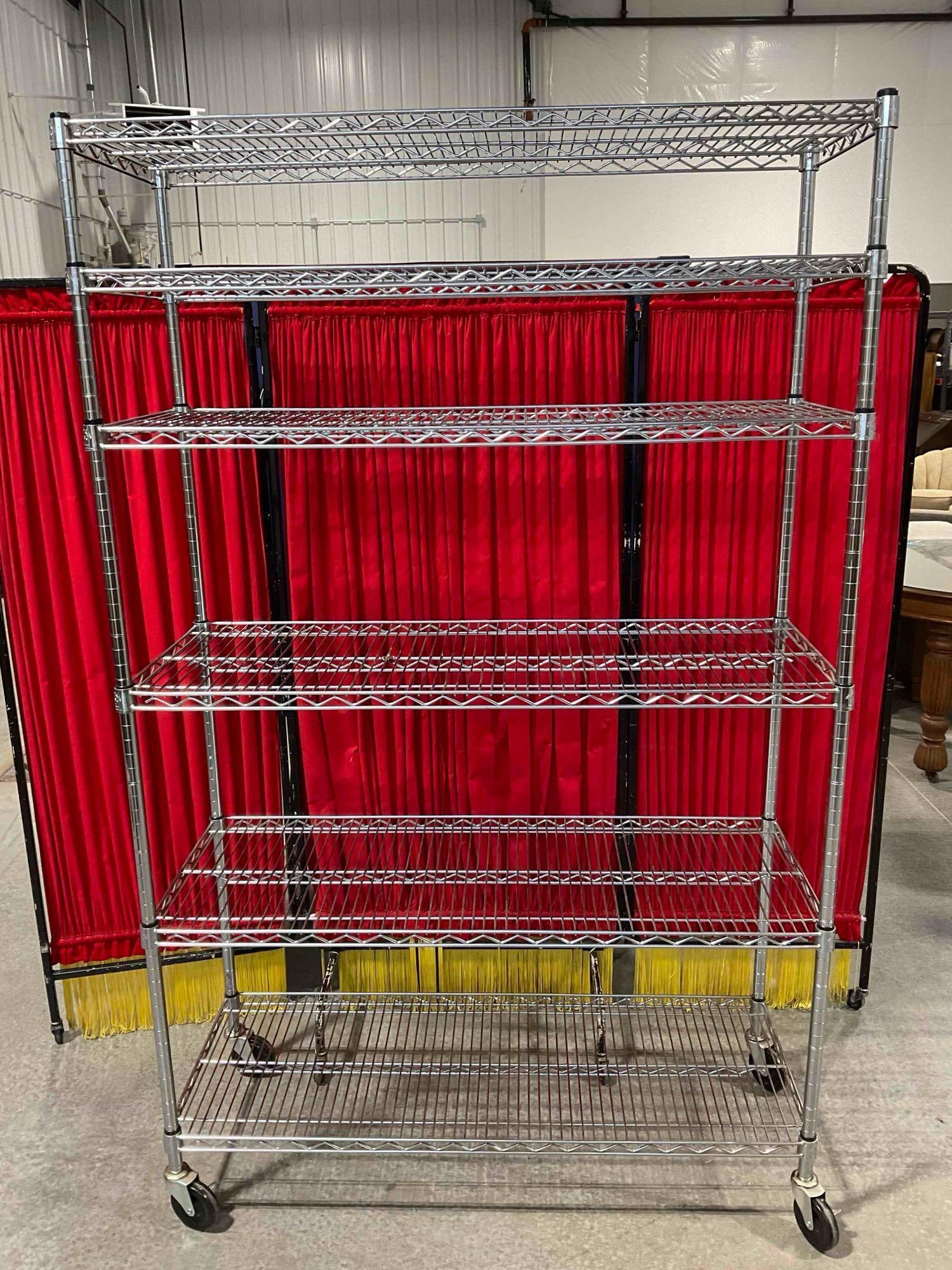 6 Tier Wire Rack Shelving Unit with Rolling Castors and a Silver Finish.: Approximately 49" x 78" x 19" item is in fairly good condition. But has a bit of rust on one shelf. See pics. Matches lot 213. V-5600 *Freight Required if shipped, Buyer Arranged/Responsibility* 