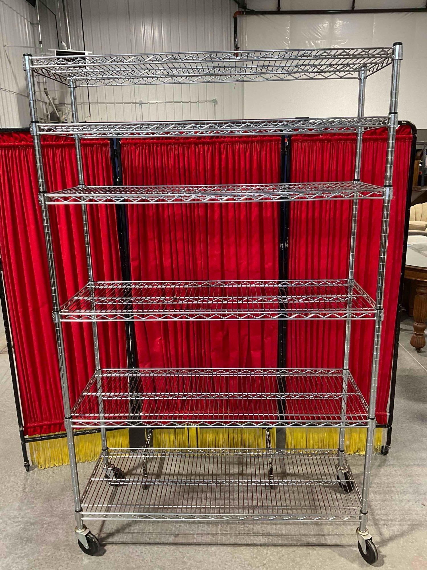 6 Tier Wire Rack Shelving Unit with Rolling Castors and a Silver Finish.: Approximately 49" x 78" x 19" item is in good condition. Matches lot 212 V-5600 *Freight Required if shipped, Buyer Arranged/Responsibility* 