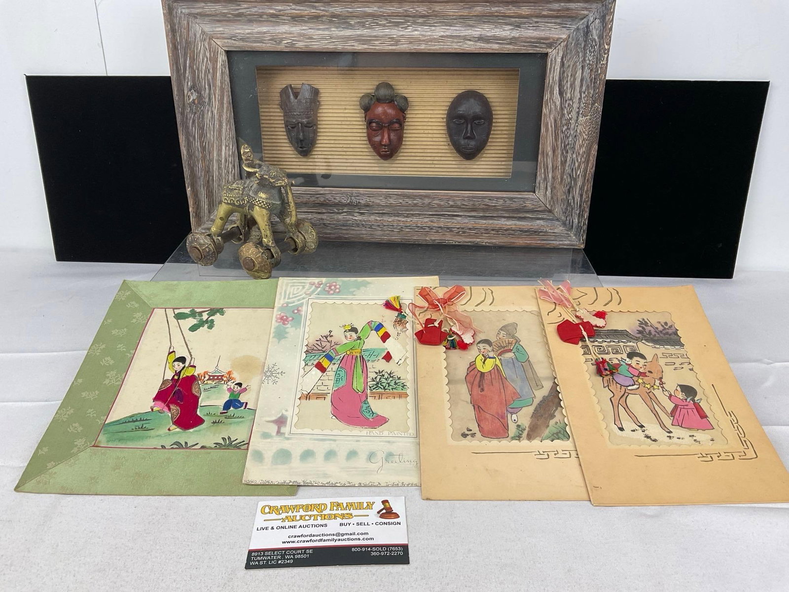 Framed Shadowbox w/3 masks, Indian Carved Brass Toy, Elephant w/ Wheels, 4 Watercolor Greeting Ca...: Appears to be in good shape. The piece measures approx 7h x 16w x 9d inches. See pics. E-5500
