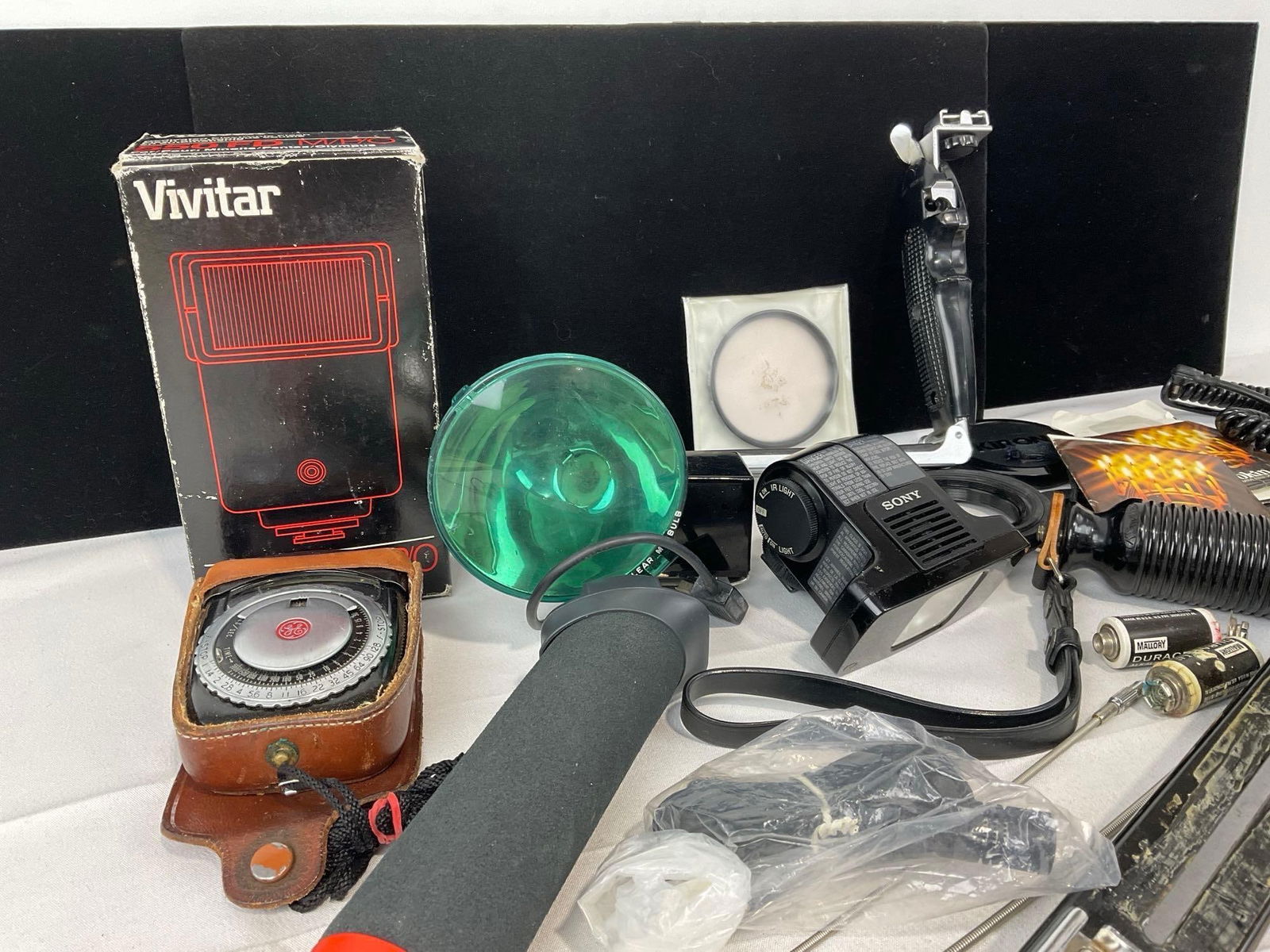 Asst Camera Accessories, Vivitar Flash Module & more, couple Grips, Filters - 2