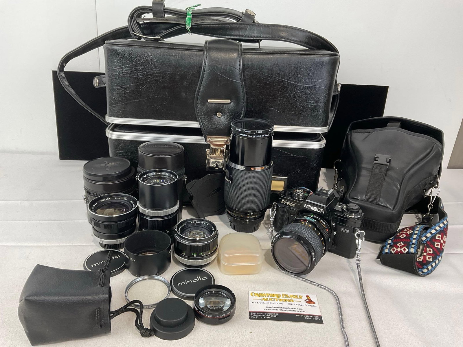 Minolta X-700 Film Camera w/ 5 Lenses & Cases, w/Large Black Leather Camera Case: Appears to be in good shape. The piece measures approx 13h x 17w x 8d inches. See pics. E-5580 