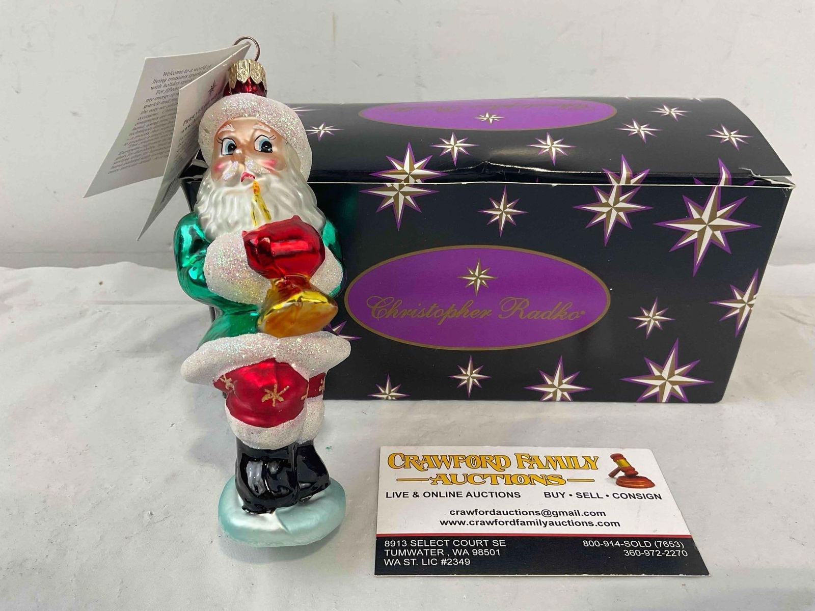 Christopher Radko Glass Santa Claus Ornament w/ Tag & Original Box. Excellent Condition. See pics.: Christopher Radko Glass Santa Claus Ornament w/ Tag & Original Box. Excellent Condition. "strike Up the Band" is the name of the ornament. Box is slightly misshapen, otherwise in excellent conditi