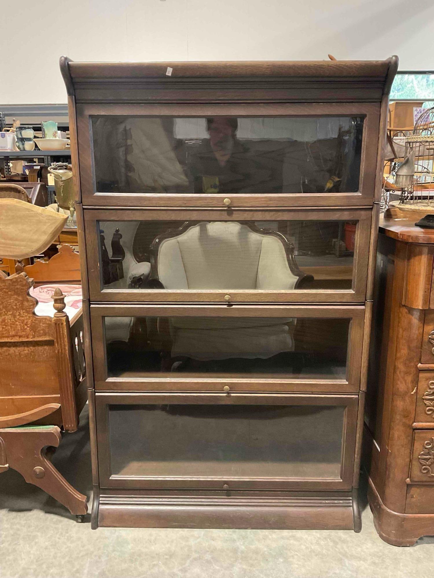 Vintage Oak Wood 4-Tier Glass Fronted Barrister Bookcase w/ Dark Stain. Excellent Condition.: Vintage Oak Wood 4-Tier Glass Fronted Barrister Bookcase w/ Dark Stain. Excellent Condition. Measures 34" x 14" x 56" DM-5690 *Freight Required if shipped, Buyer Arranged/Responsibility* 