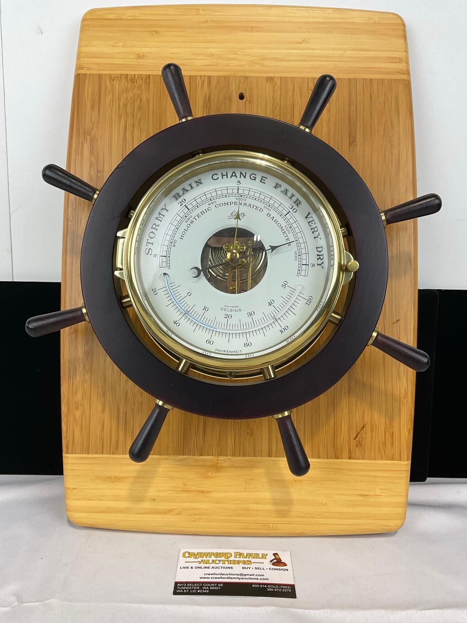 Ships Wheel Schatz Weather Station, Wood & Brass 8 Spoke Wheel, 19h x 13w x 5d inches: Has Barometer & temperature. Very similar case & board as the next lot. All from the same collection. Appears to be in fair to good shape. The piece measures approx 19h x 13w x 5d inches. See