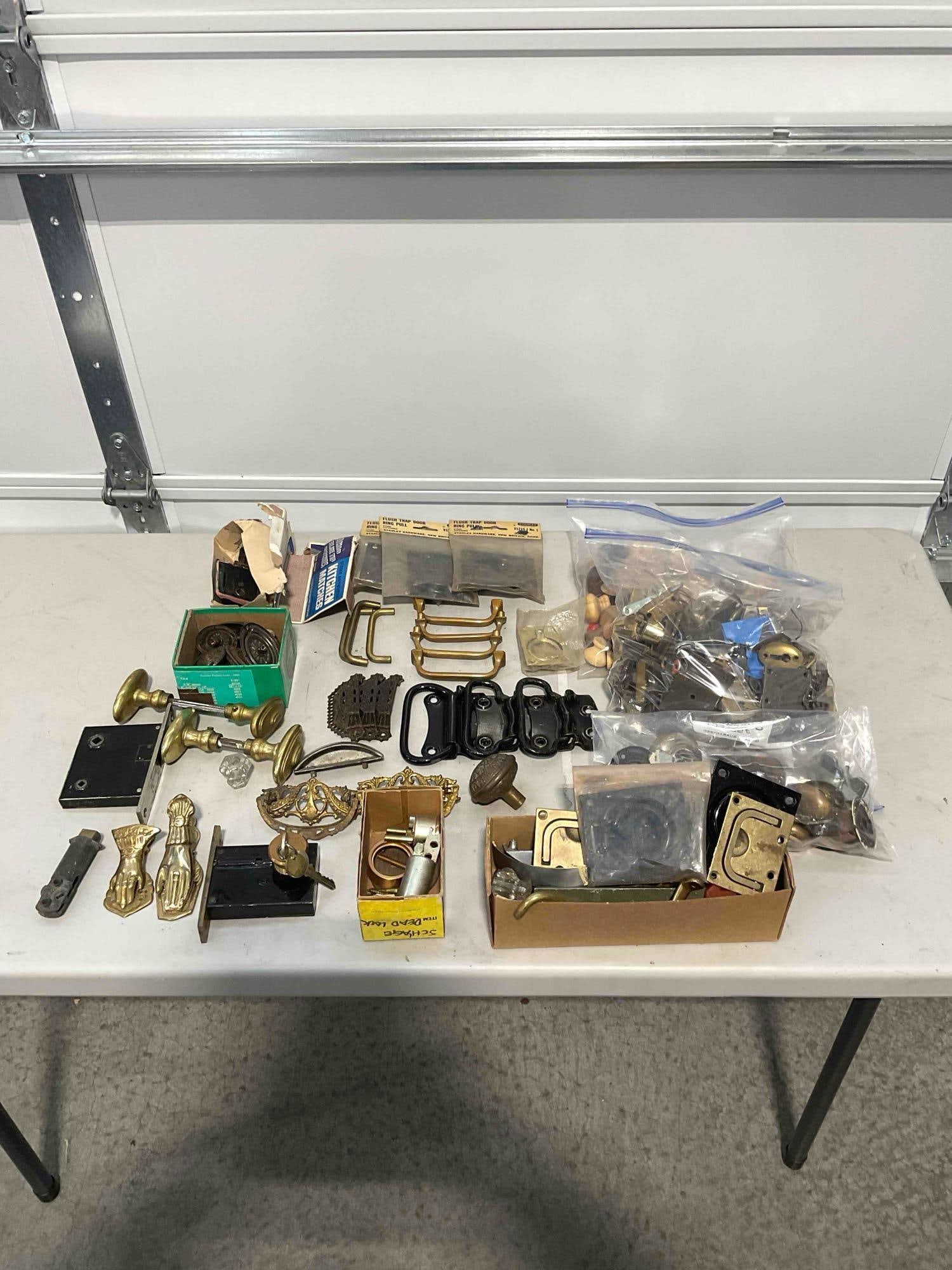 Collection of Vintage Household Hardware Including, Brass Knobs, Door Locks, Ring-Pulls: Fits into a container approximately 14" x 14" x 10". Items are in mostly fair condition and have wear consistent with age and use. V-5360 