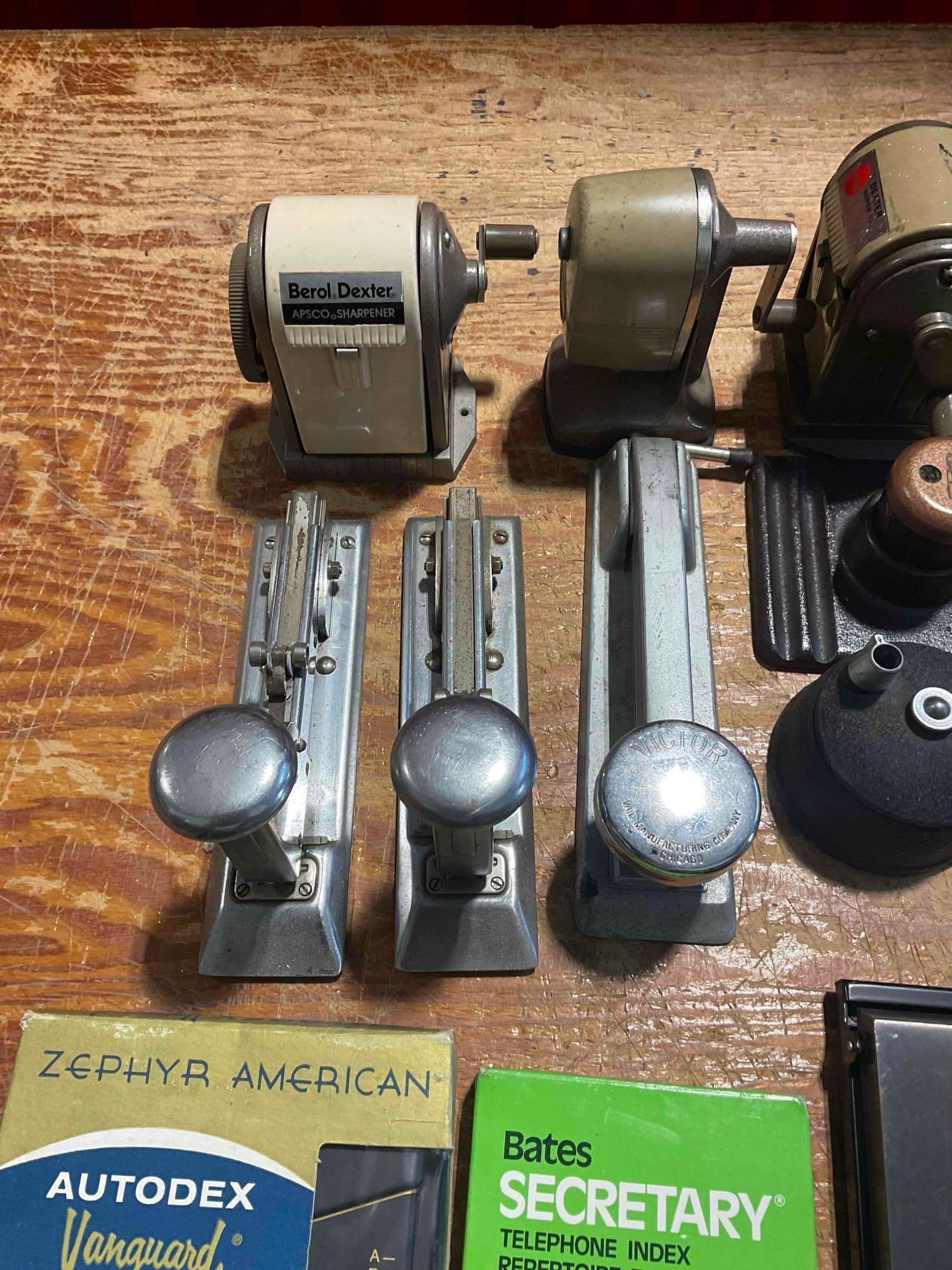 A Collection of Vintage Office Gear, Pencil Sharpeners, Staplers, and Phone Indexs - 2