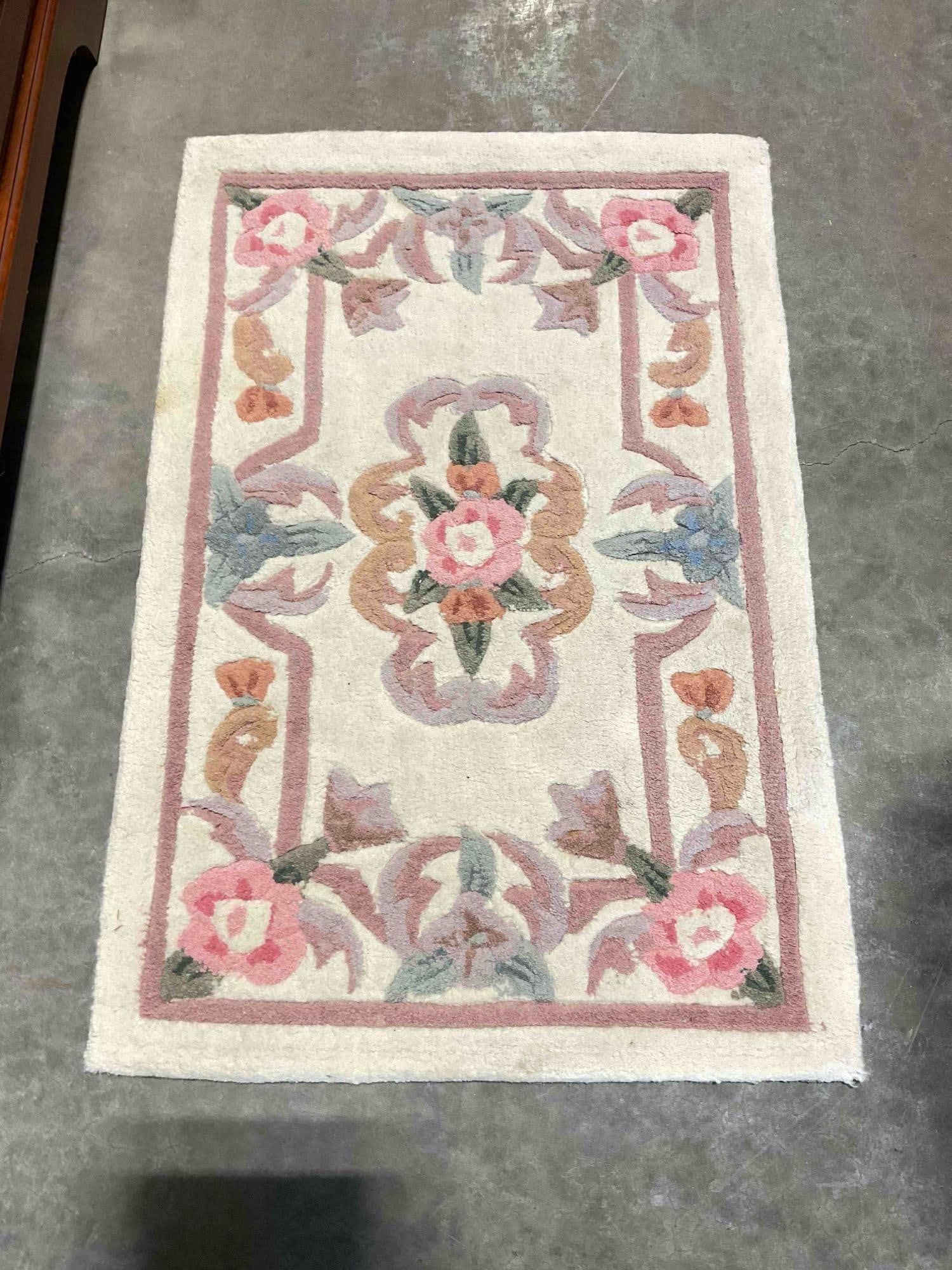 Serena Ivory Wool Pile Runner Rug w/ Floral Design. Very Good Condition. Measures 23" x 35": Serena Ivory Wool Pile Runner Rug w/ Floral Design. Very Good Condition. Pair to lot 129. Measures 23" x 35" minor dirt and wear indicative of age and use, condition is otherwise very good. DM-5730 
