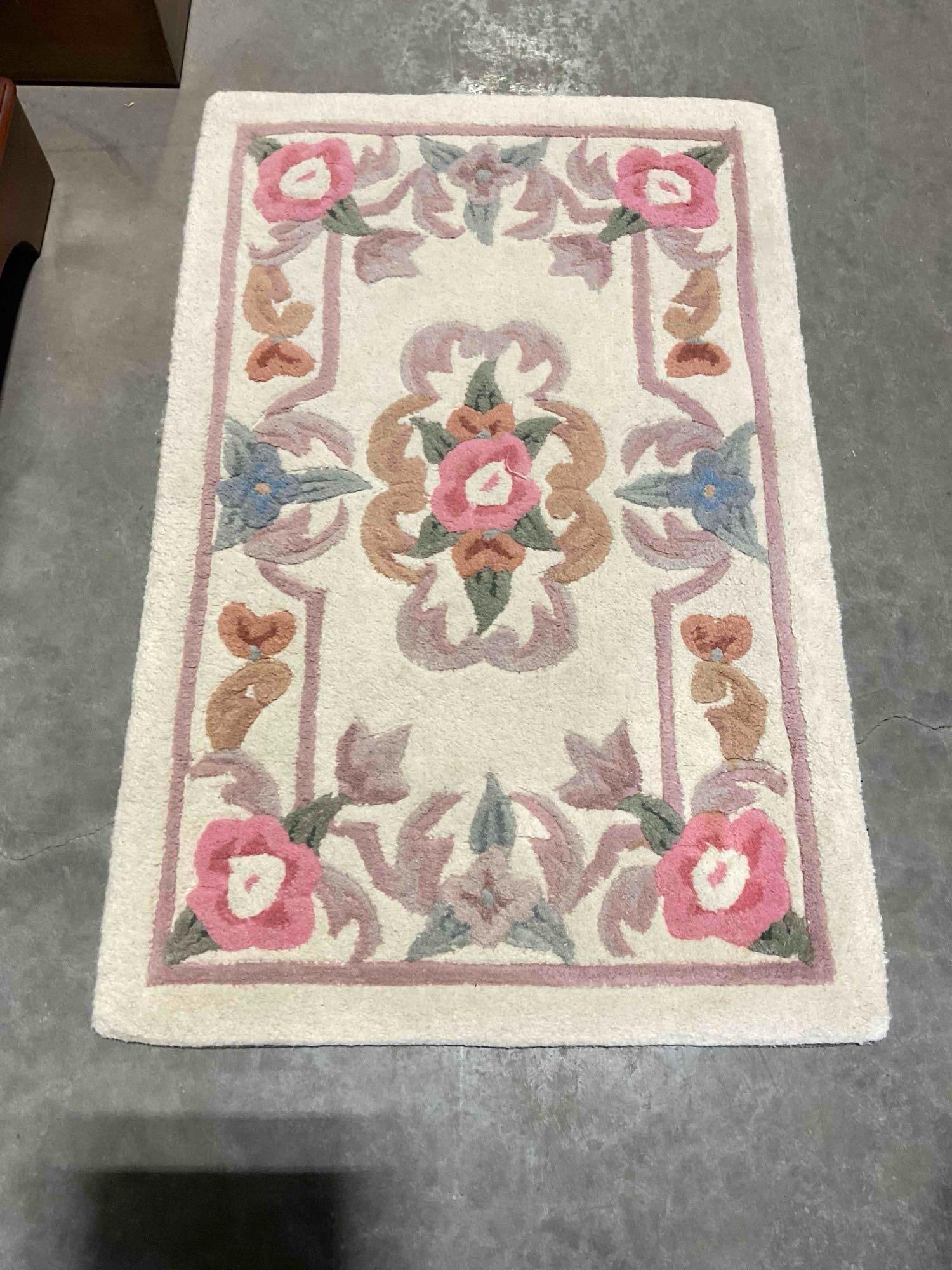 Serena Ivory Wool Pile Runner Rug w/ Floral Design. Very Good Condition. Measures 23" x 35": Serena Ivory Wool Pile Runner Rug w/ Floral Design. Very Good Condition. Measures 23" x 35" Pair to lot 128. minor dirt and wear indicative of age and use, condition is otherwise very good. DM-5730 