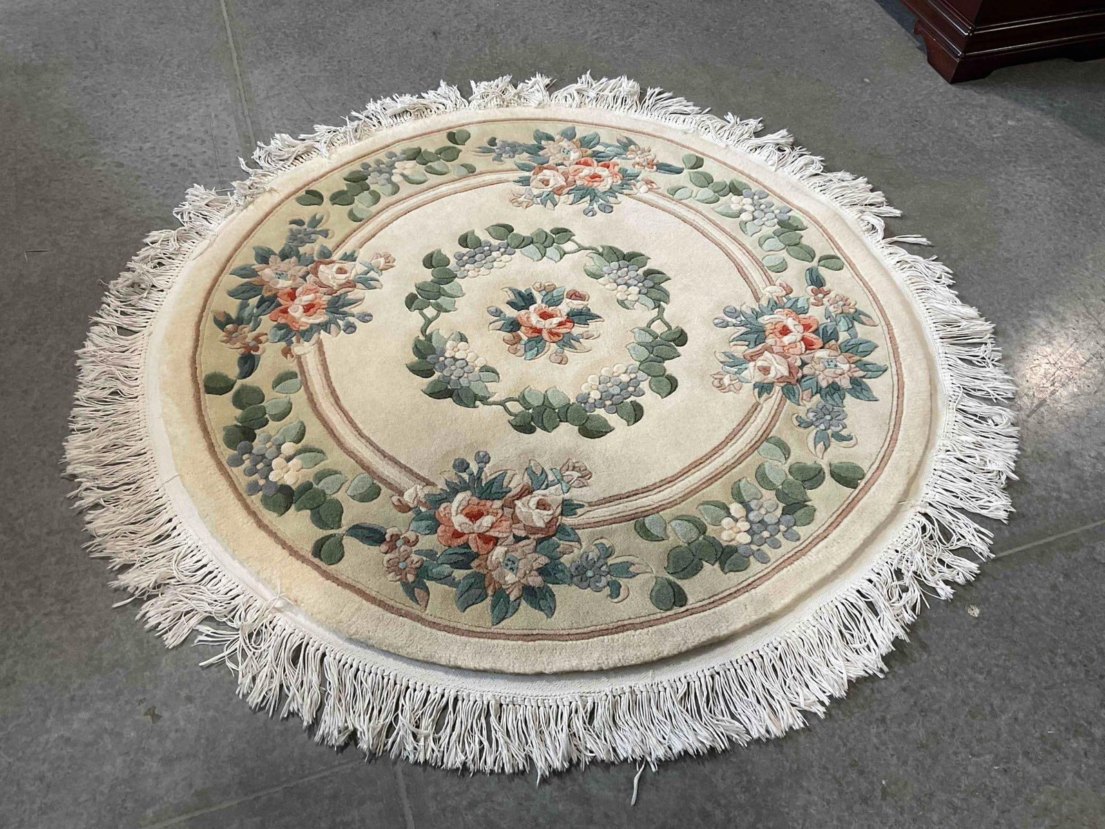 Woven Legends Ivory Wool Pile Round Rug w/ Floral Design. Very Good Condition. 59" x 59": Woven Legends Ivory Wool Pile Round Rug w/ Floral Design. Very Good Condition. 59" x 59" Minor wear indicative of age and use, condition is otherwise very good. DM-5730 
