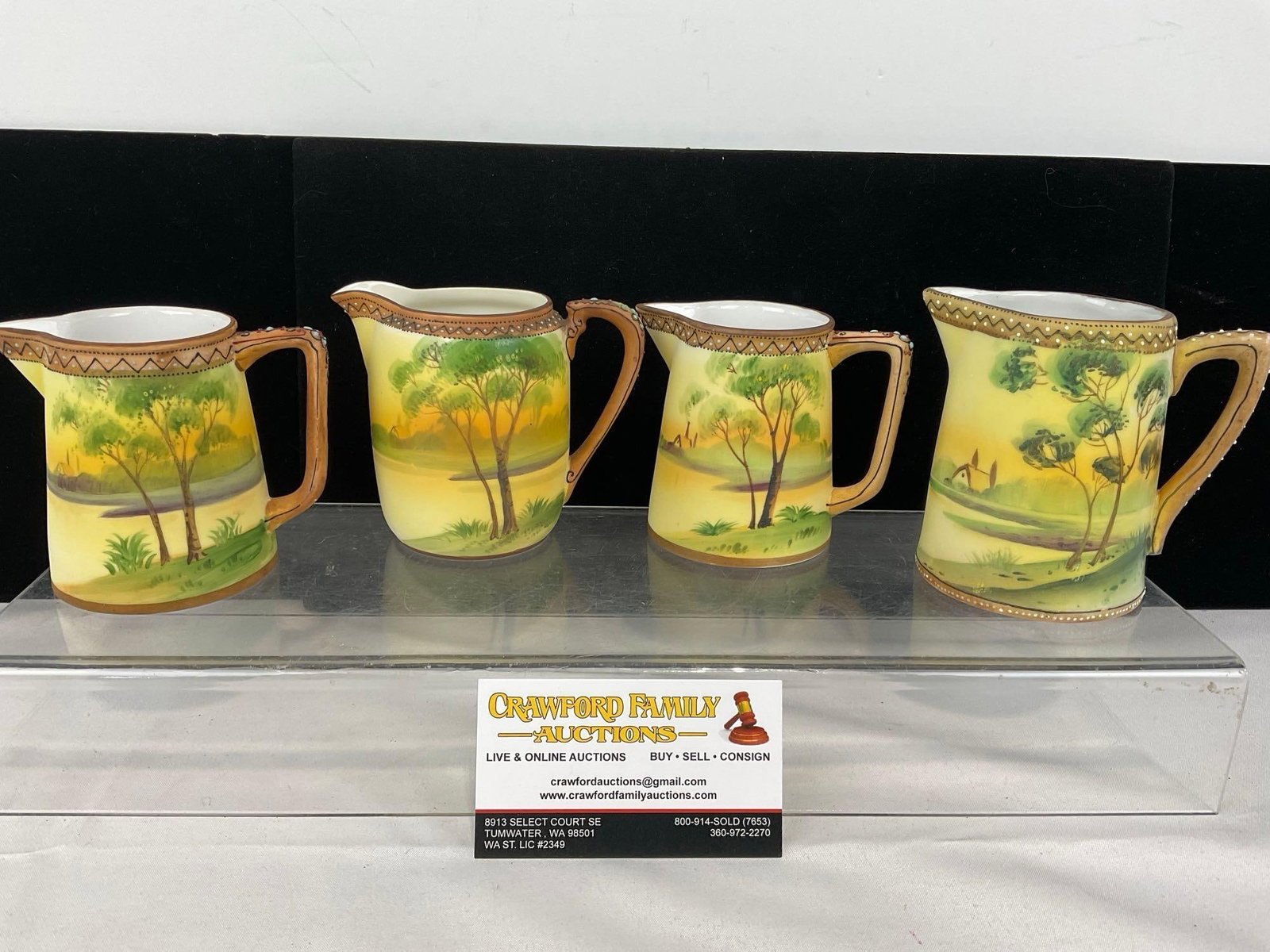 4 Handpainted Nippon China, Yellow & Green, Creamer Pitchers, Tree Village River Scenes: Appears to be in good shape. The piece measures approx 5h x 10w x 6d inches. See pics. E-5700 