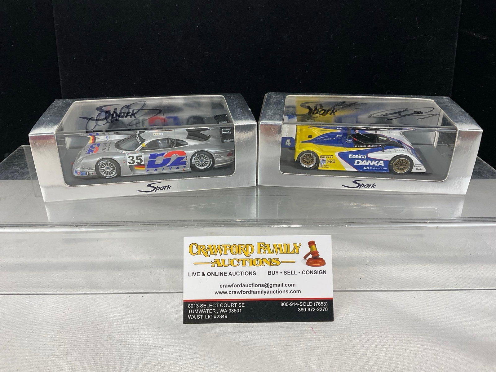2 Spark 1/43 Scale Diecast Cars, 1996 Riley & Scott Oldsmobile & 98 Mercedes CLK, signed by drivers: One signed by Scott Sharp & Jim Pace, the other is signed by Mark Webber. All comes from the same collection. Appears to be in good shape. The piece measures approx 6h x 7w x 4d inches. See pics.