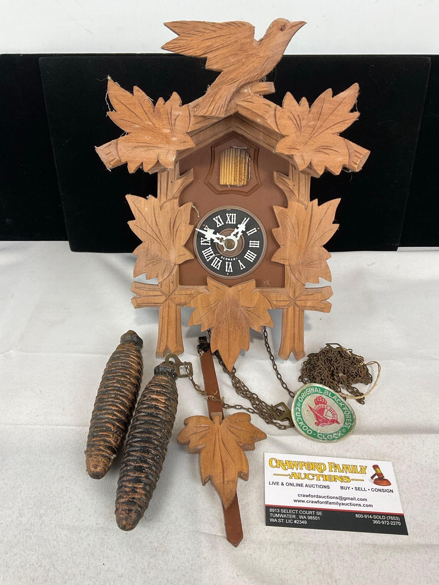 Original Black Forest Cuckoo Clock Hubert Herr w/pinecone weights, carved wood, 7h x 13w x 9d inc...: Appears to be in good shape. The piece measures approx 7h x 13w x 9d inches. See pics. E-5690 