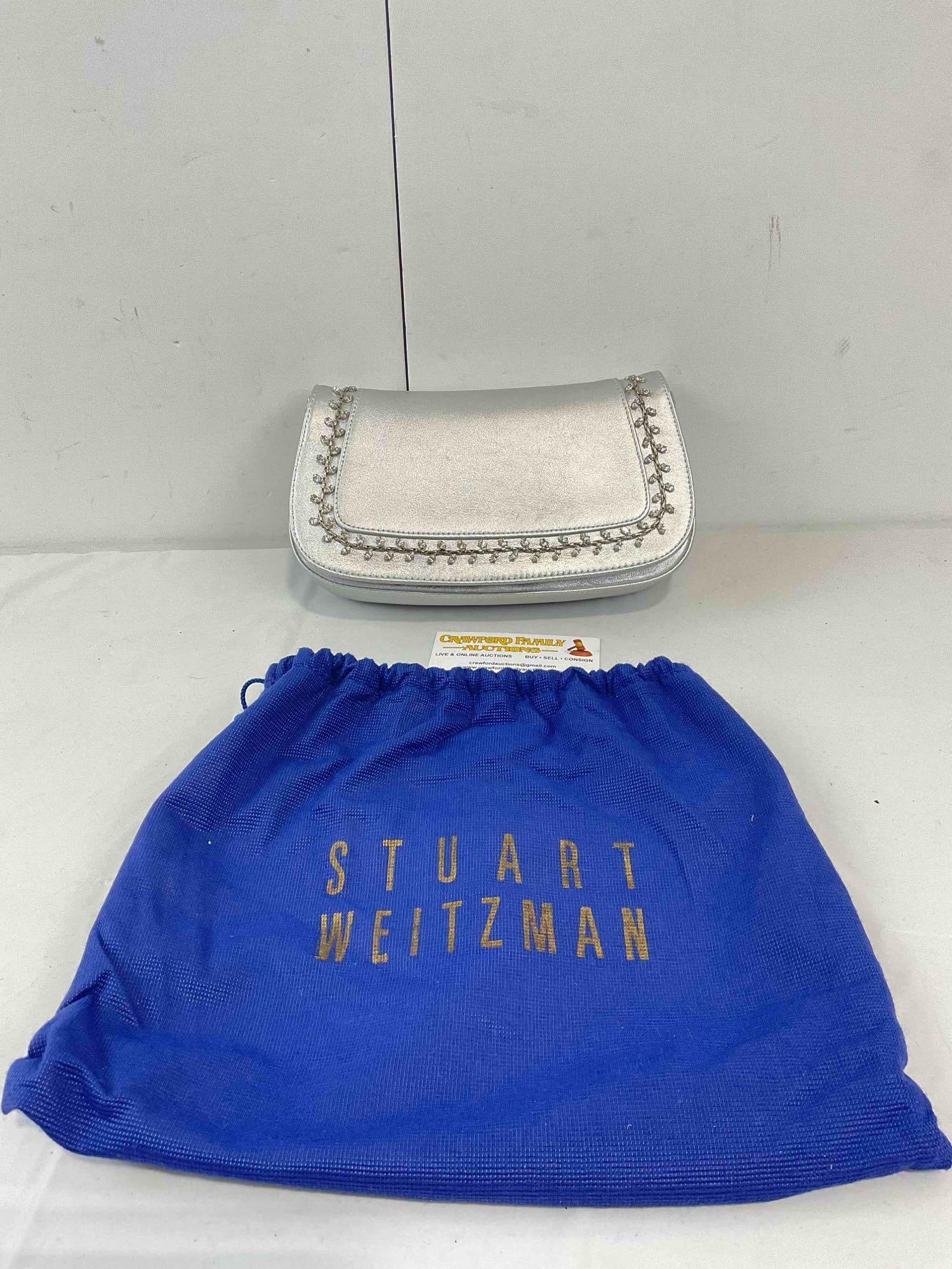 Stuart Weitzman Silver Leather Clutch Purse w/ Rhinestone Embellishment. Very Good Condition.: Stuart Weitzman Silver Leather Clutch Purse w/ Rhinestone Embellishment. Very Good Condition. Minor stains and wear indicative of age and use. Includes carrier bag. Measures 11" x 8" x 7" x DM-5730 