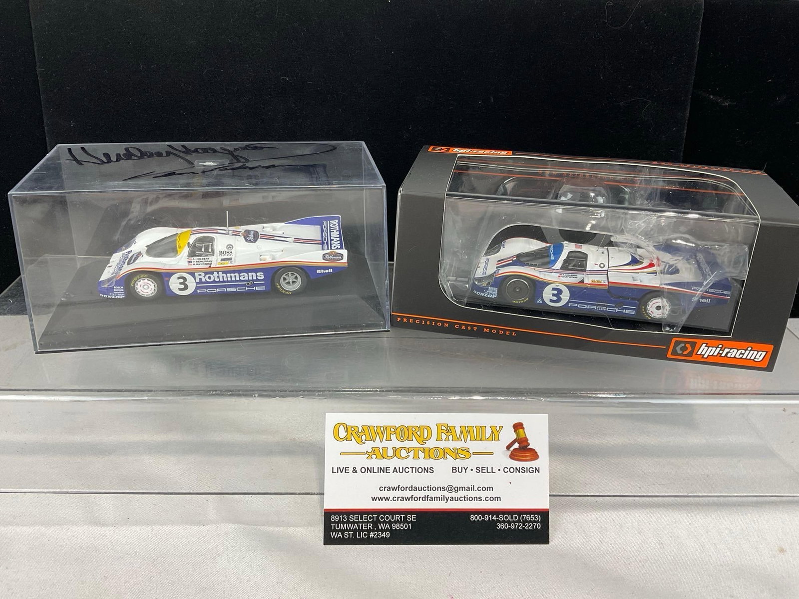 2 1/43 Scale Diecast Cars, 1982 & 1983 Porsche 956L, 1 signed by Hurley Haywood: Appears to be in good shape. The piece measures approx 6h x 7w x 4d inches. See pics. E-5420 
