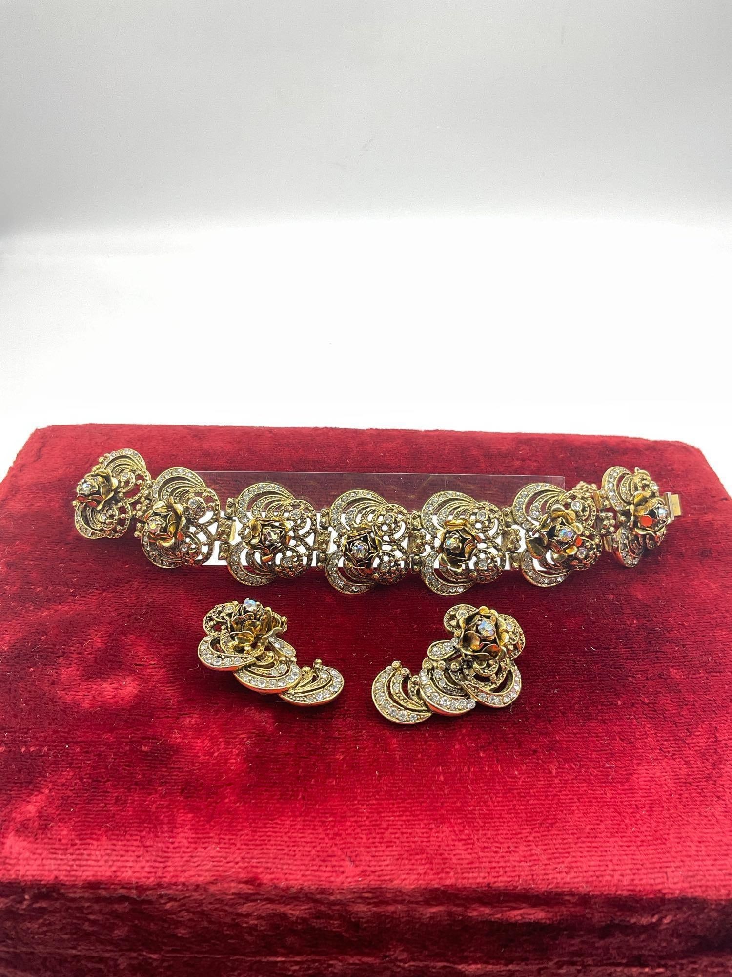High end Vintage Hobe Aurora Borealis Rhinestone Floral designed Bracelet & matching earrings: C-5250 Bracelet is approx 7" in length Stunning mufti colored rhinestones See pics 