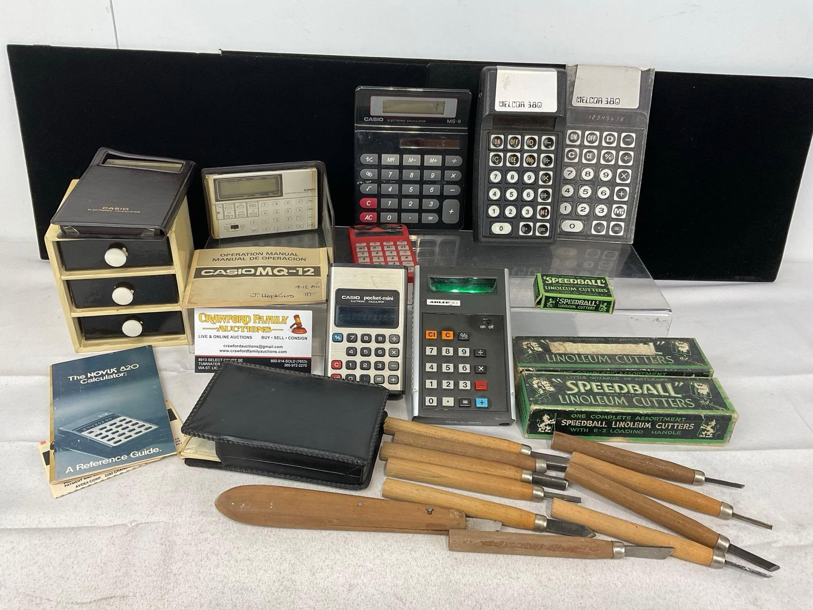 Collection of Vintage Calculators, 4x Casio, Melcor, Adler & Several Linoleum Cutters: Appears to be in good shape. The piece measures approx 5h x 14w x 10d inches. See pics. E-5360