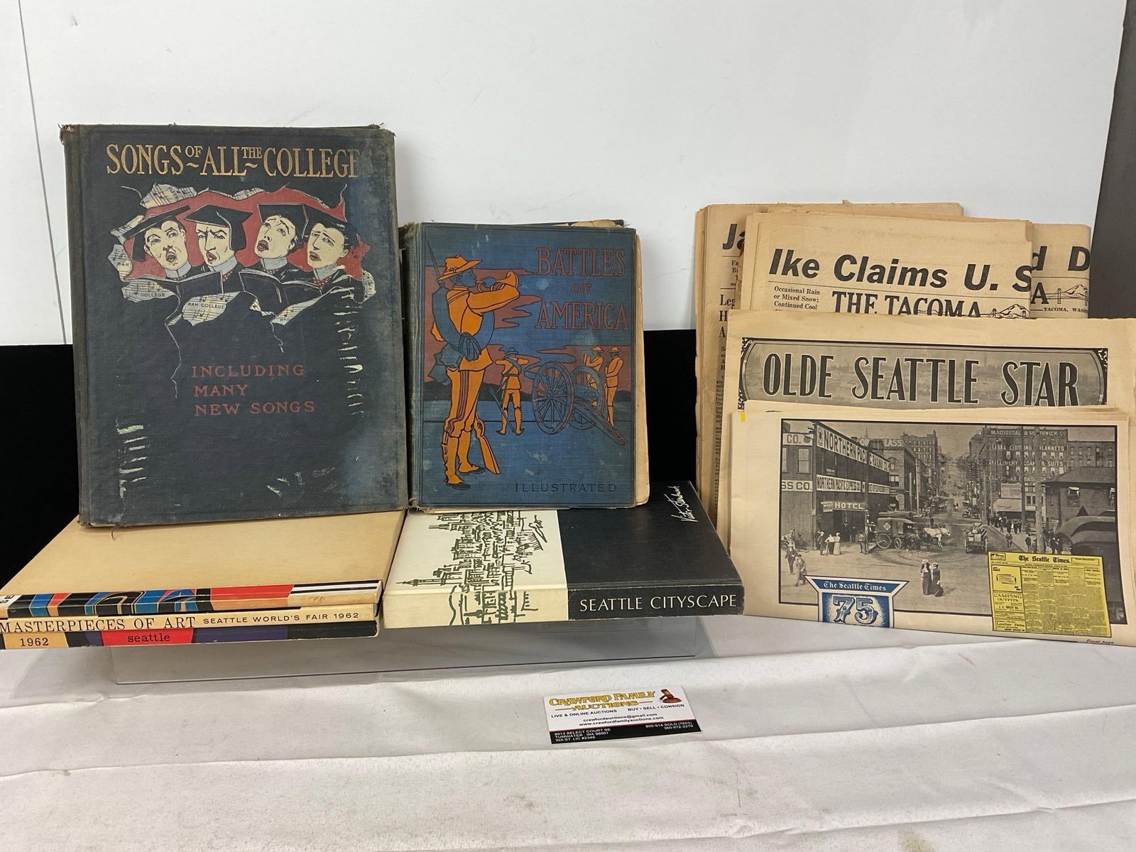 2 1900s Antique Books, 1962 Seattle Books, & set of 50s Newspapers, The Tacoma News Tribute: Appears to be in good shape. The piece measures approx 5h x 15w x 10d inches. See pics. E-5360