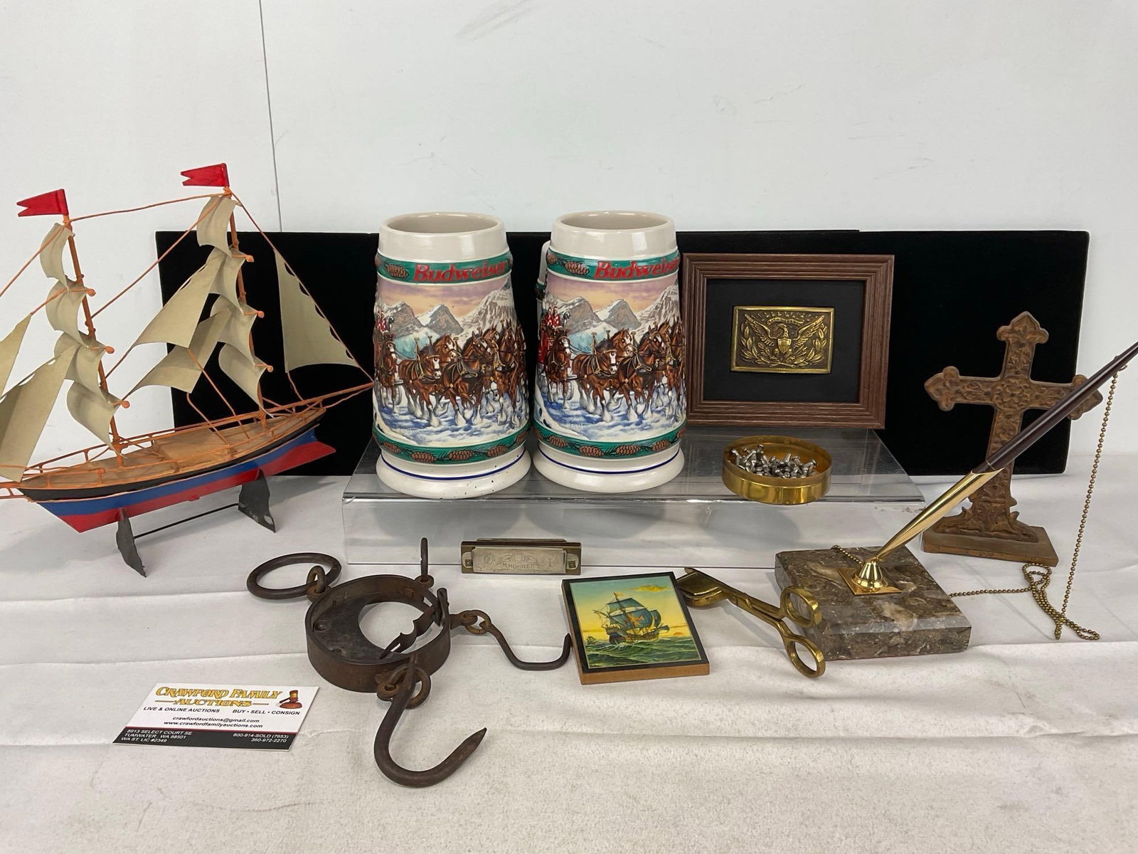 2 90s Budweiser Steins, Cast metal cross, Antique Scale, Framed Belt Buckle, Desk Pen Holder & more: Appears to be in good shape. The piece measures approx 6h x 17w x 14d inches. See pics. E-5360
