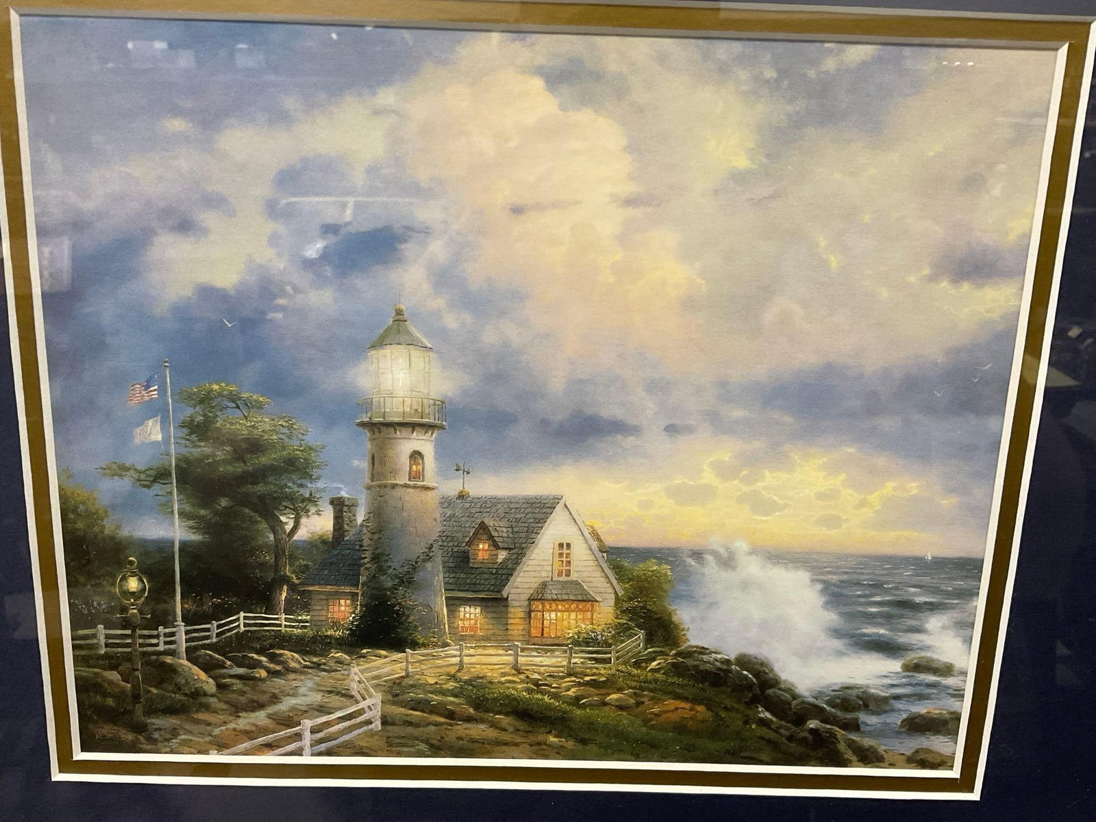 Framed Library Edition Lithograph, titled A Light in the Storm by Thomas Kinkade, 17h x 19w inches - 2