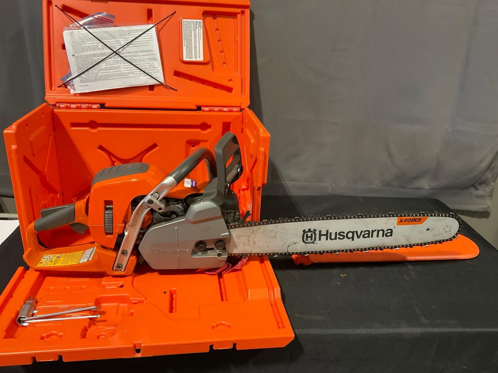 Husqvarna AutoTune 550XP Mark II Chainsaw, 50cc engine, X-Force Blade w/case: *No in-house shipping available, hazardous materials* Was tested by the consignor before putting in storage, assumed still working. Appears to be in good shape. The piece measures approx 14h x