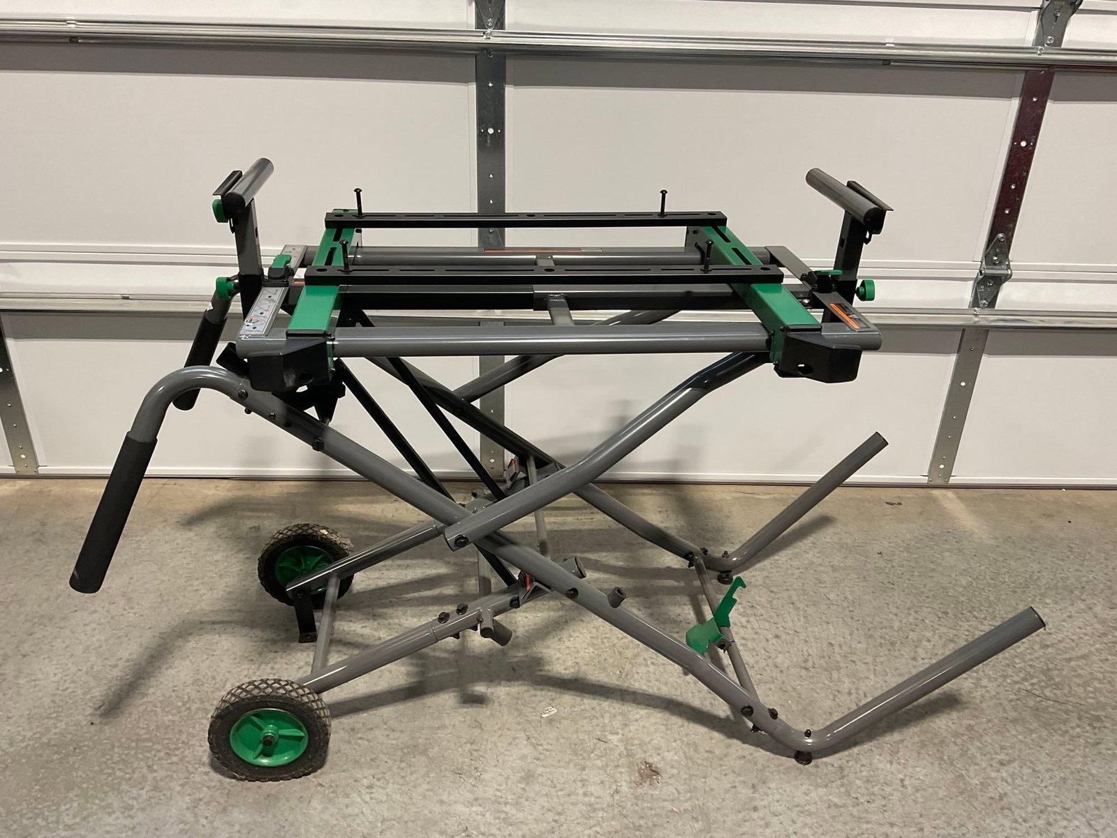 Hitachi UU 240R Universal Miter Saw Stand, roughly 54h x 32w x 20d inches: Appears to be in good shape. The piece measures approx 54h x 32w x 20d inches. See pics. E-5600 *Freight Required if shipped, Buyer Arranged/Responsibility*