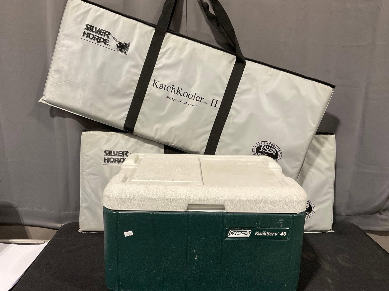Coleman KwikServ 40 liter cooler, & Pair of Silver Horde KatchKooler II: Appears to be in good shape, some discoloration from use. The piece measures approx 17h x 40w x 17d inches. See pics. E-5600