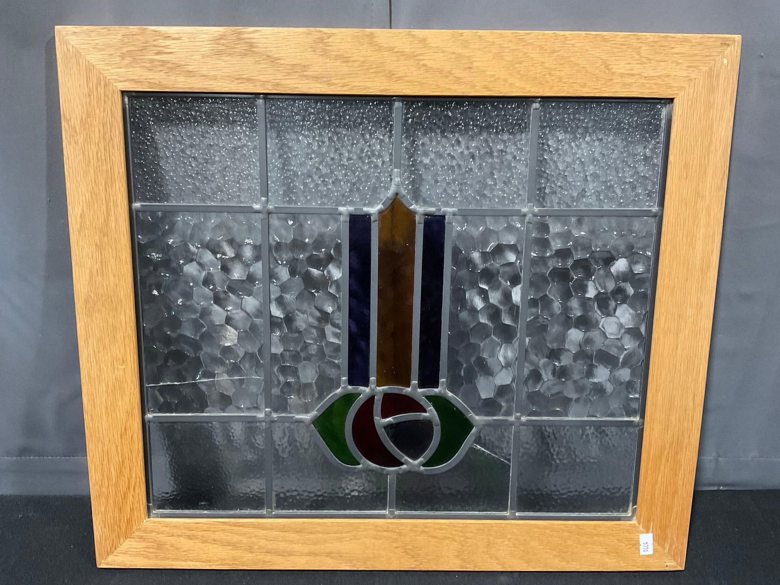Antique Old English style Leaded Rose Window, newer pine frame, multicolor design, 20x23 inch: Similar to the next piece, this one has a couple cracks. Appears to be in fair to good shape, a couple cracks in two of the pebbled panels, possibly not the original frame. The piece measures approx