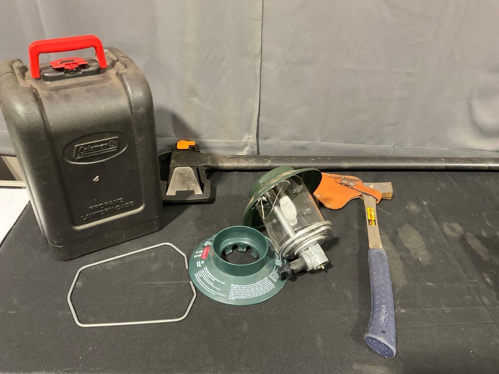 Fiskars Axe, Estwing Hatchet, w/sheaths & Coleman Lantern, broken glass globe: Appears to be in good shape. The piece measures approx 37h x 11w x 12d inches. See pics. E-5600